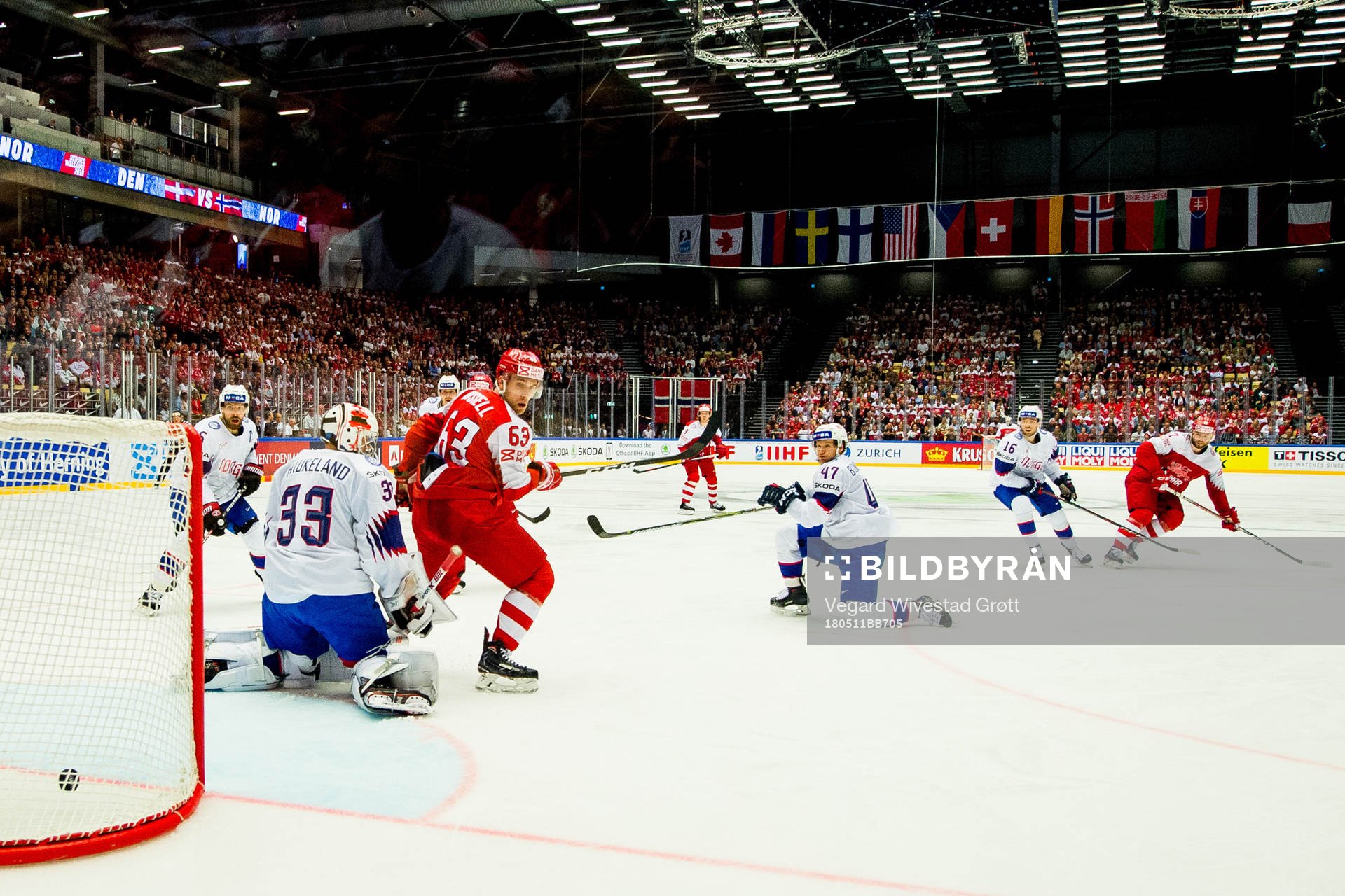 Nicklas Jensen of Denmark scores 2-0 behind goaltender