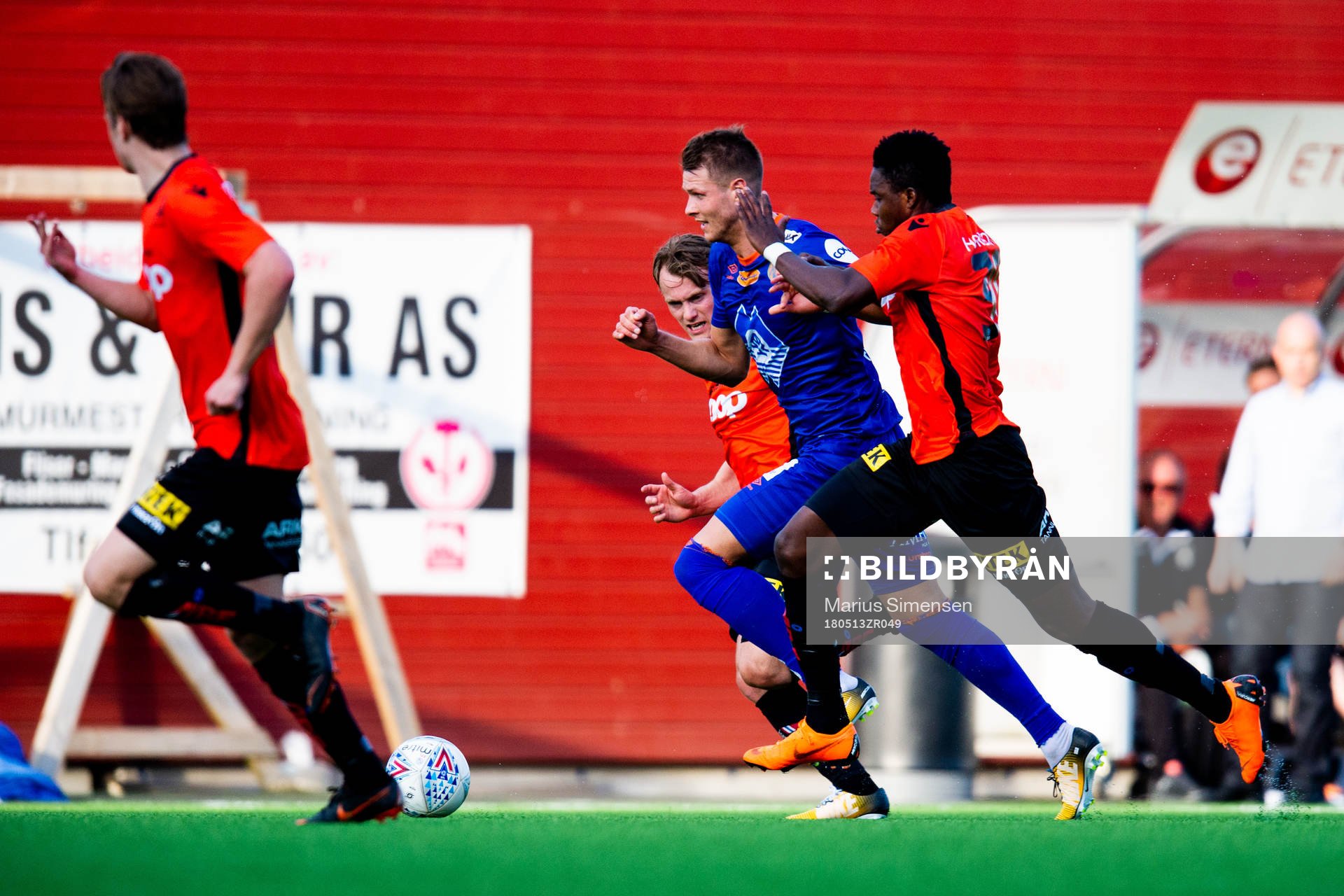 Hólmbert Fridjónsson of Aalesund and Michael Olusoji Ogungbaro of Åsane during the OBOS-ligaen match between Åsane and Aalesund on May 13, 2018 in Åsane.