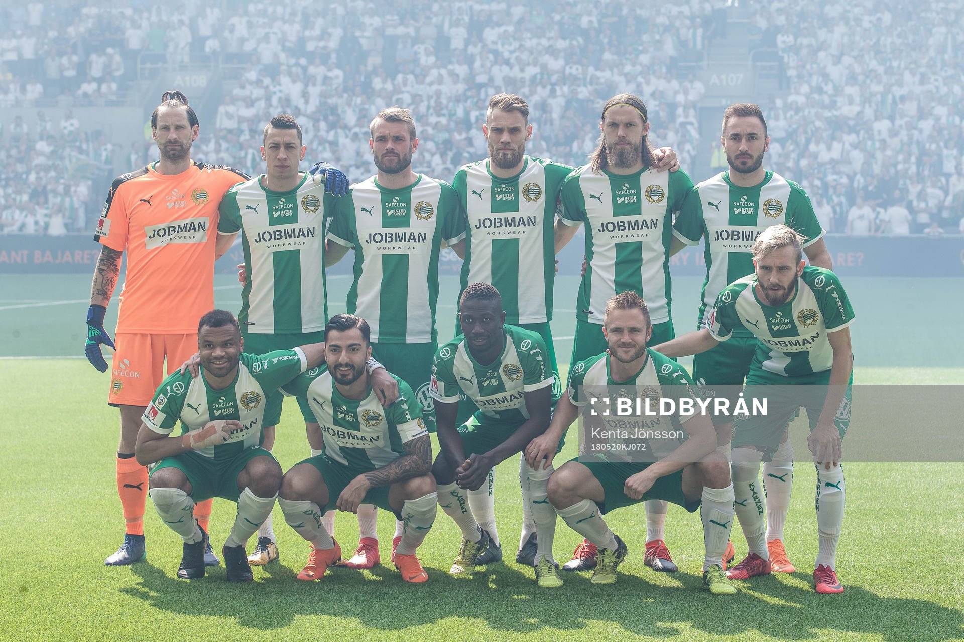 Hammarbys startelva med målvakt Johan Wiland , Nicola Djurdjic , Mads Fenger Nielsen , David Fällman , Björn Paulsen , Muamer Tankovic , Serge-Junior Martinsson Ngouali , Jiloan Hamad , Pa Amat Dibba , Mats Solheim och Simon Sandberg innan fotbollsmatchen i Allsvenskan mellan Hammarby och AIK den 20 Maj 2018 i Stockholm.