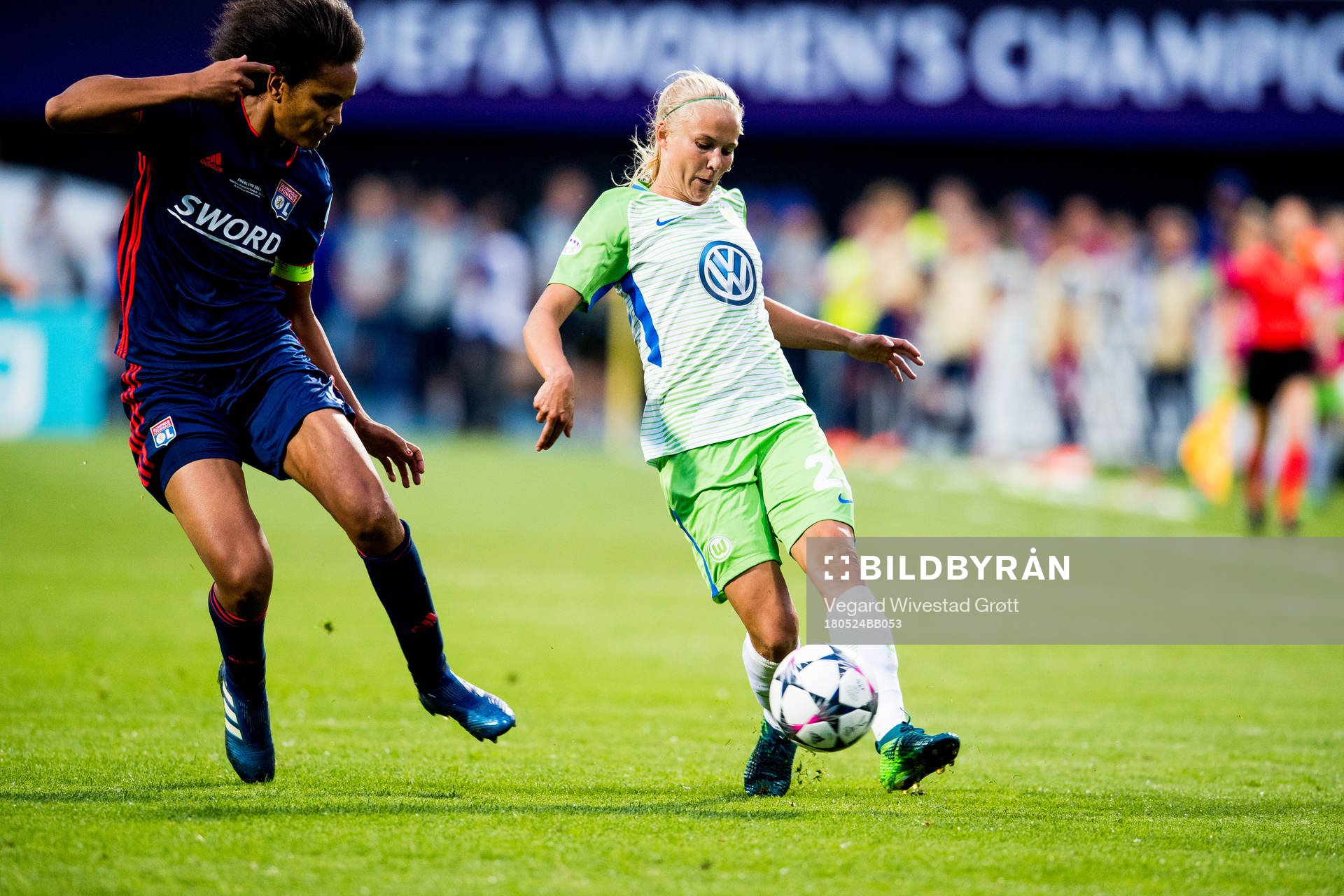 Wendie Renard of Lyon and Pernille Harder of Wolfsburg