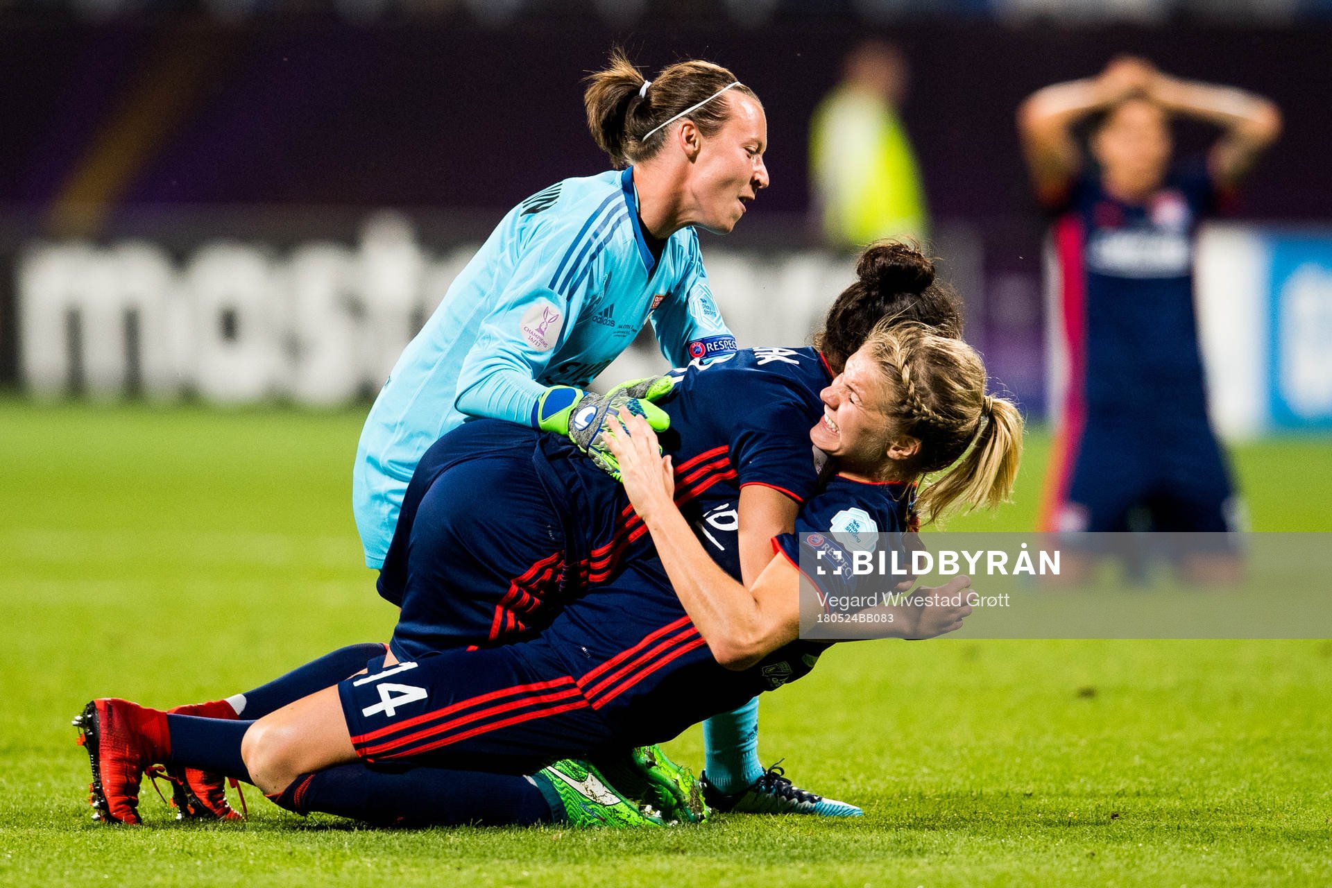 Ada Hegerberg of Lyon celebrates at the final whistle with teammates Pauline Peyraud-Magnin and Selma Bacha after winning the UEFA Women's Champions League final between VfL Wolfsburg and Olympique Lyonnais on May 24, 2018 in Kyiv.