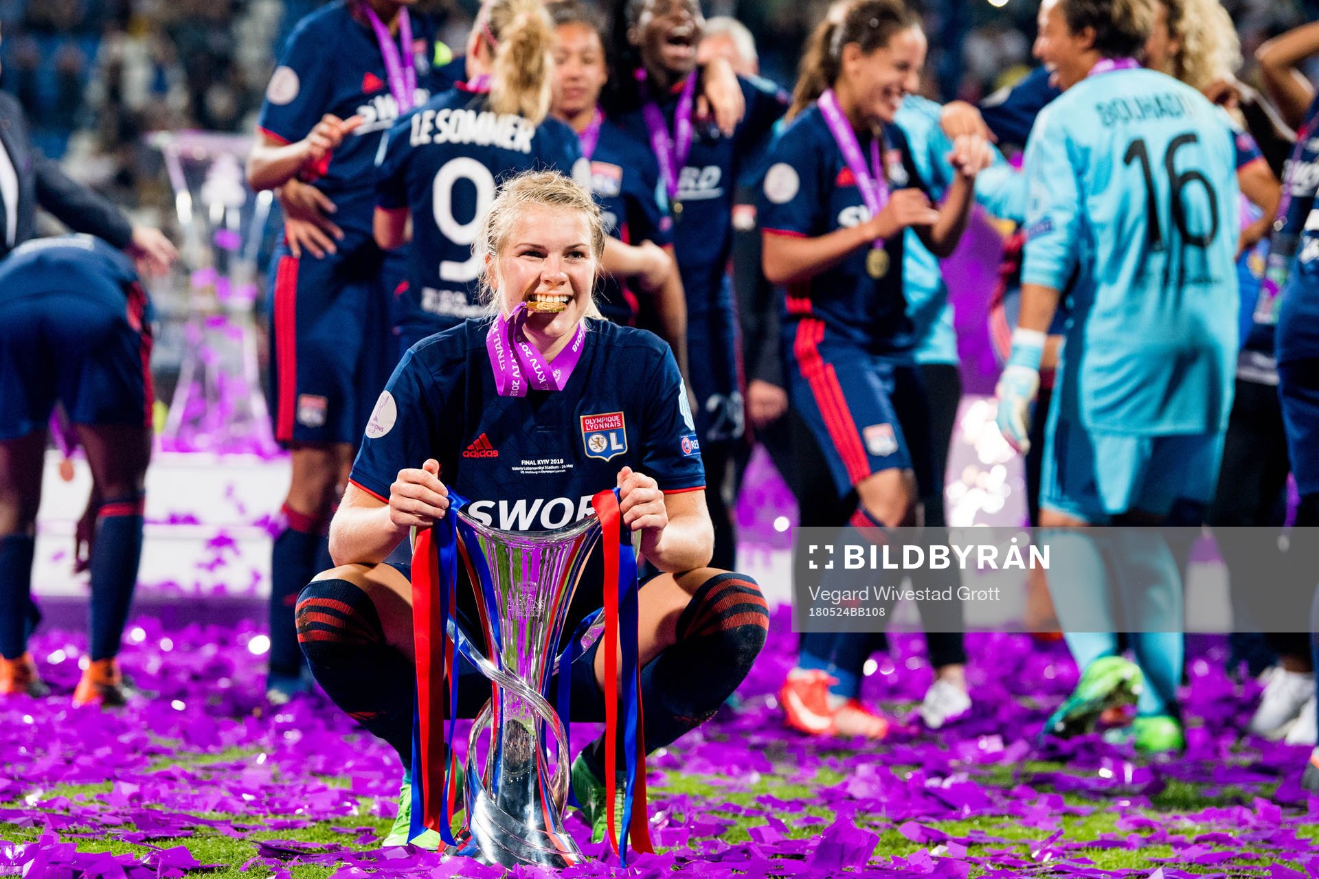 Ada Hegerberg celebrates with the trophy