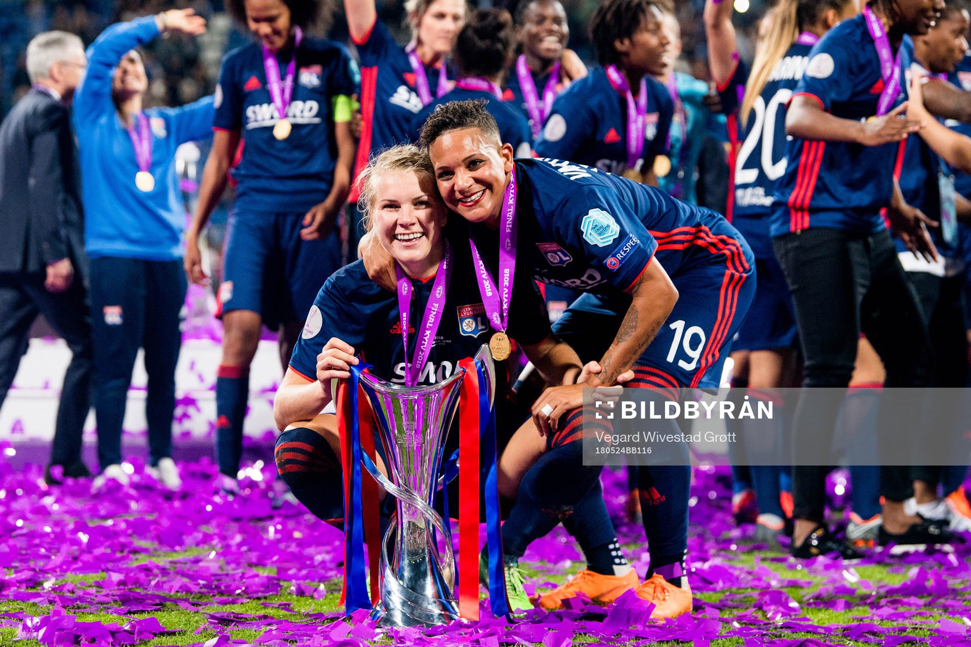 Ada Hegerberg and Shanice van de Sanden of Lyon celebrate with the trophy after winning the UEFA Women's Champions League final between VfL Wolfsburg and Olympique Lyonnais on May 24, 2018 in Kyiv.