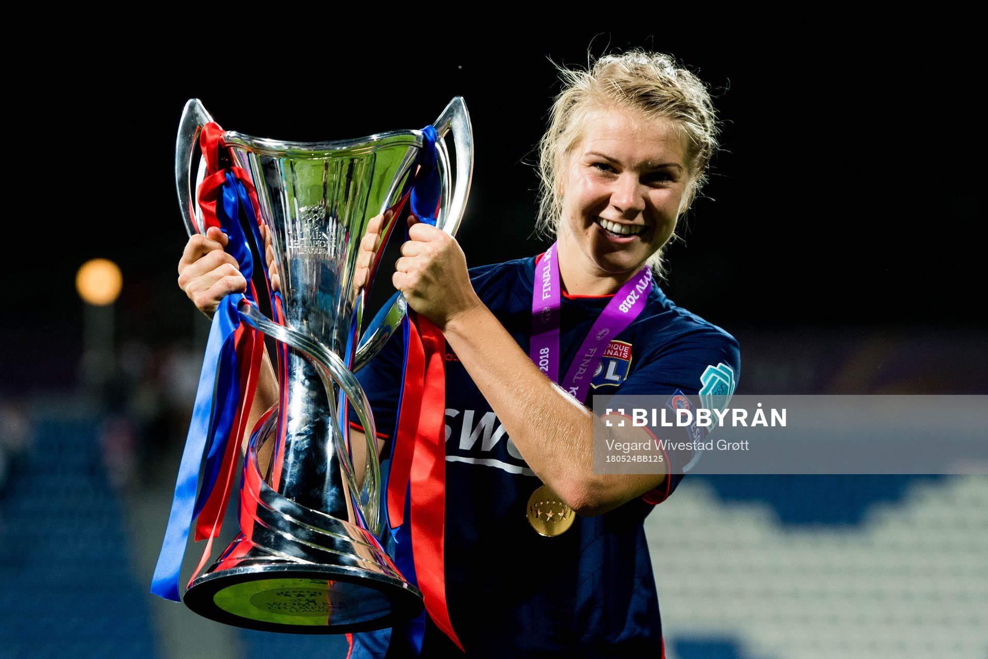 Ada Hegerberg of Lyon celebrates with the trophy