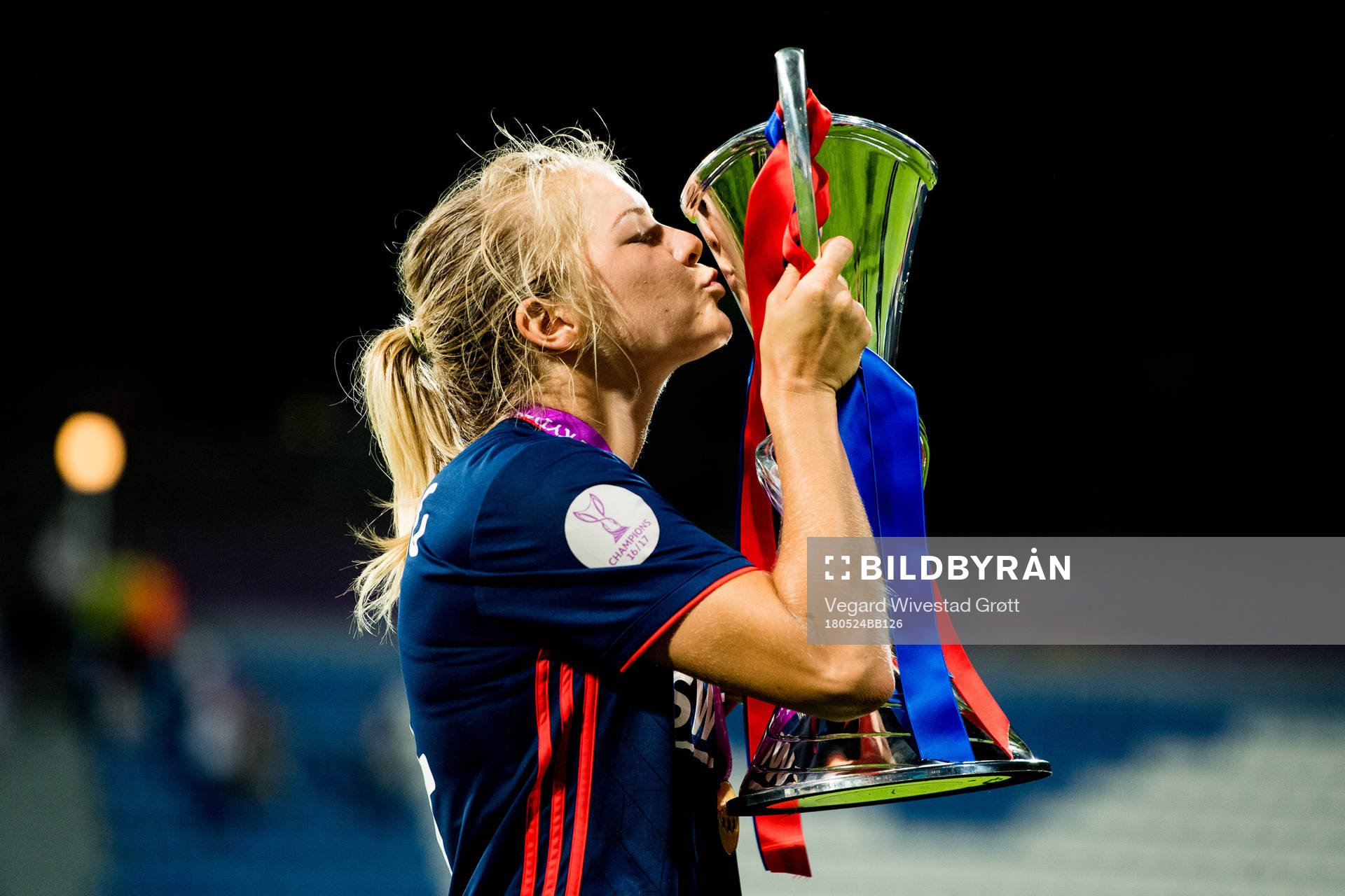 Ada Hegerberg of Lyon celebrates with the trophy