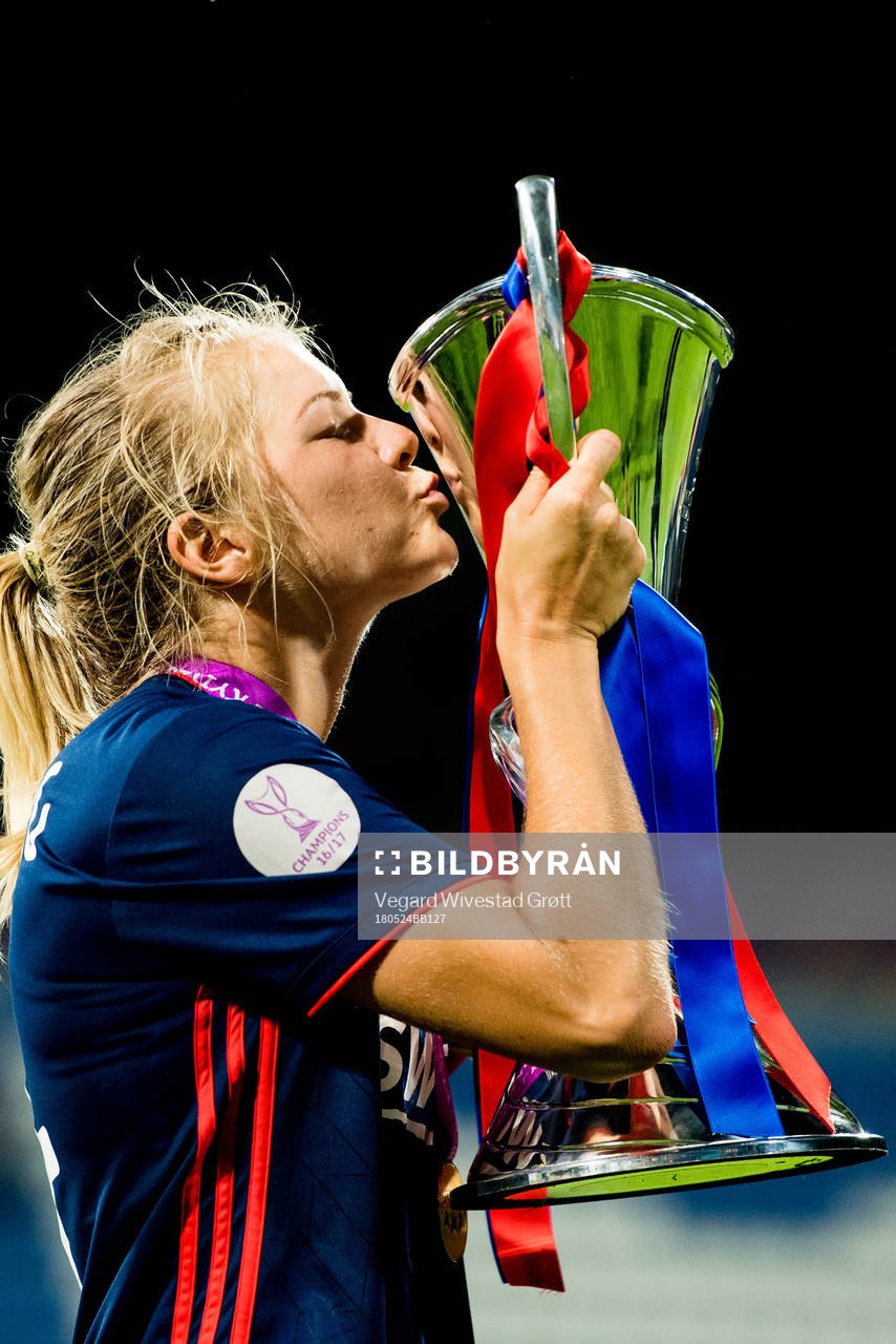Ada Hegerberg of Lyon celebrates with the trophy
