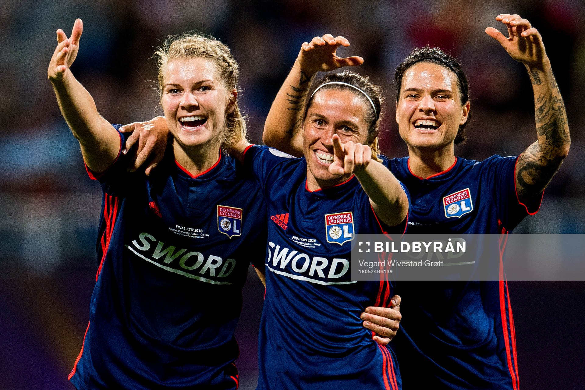 Ada Hegerberg, Camille Abily and Dzsenifer Marozsan of Lyon celebrate 4-1 during the UEFA Women's Champions League final between VfL Wolfsburg and Olympique Lyonnais on May 24, 2018 in Kyiv.