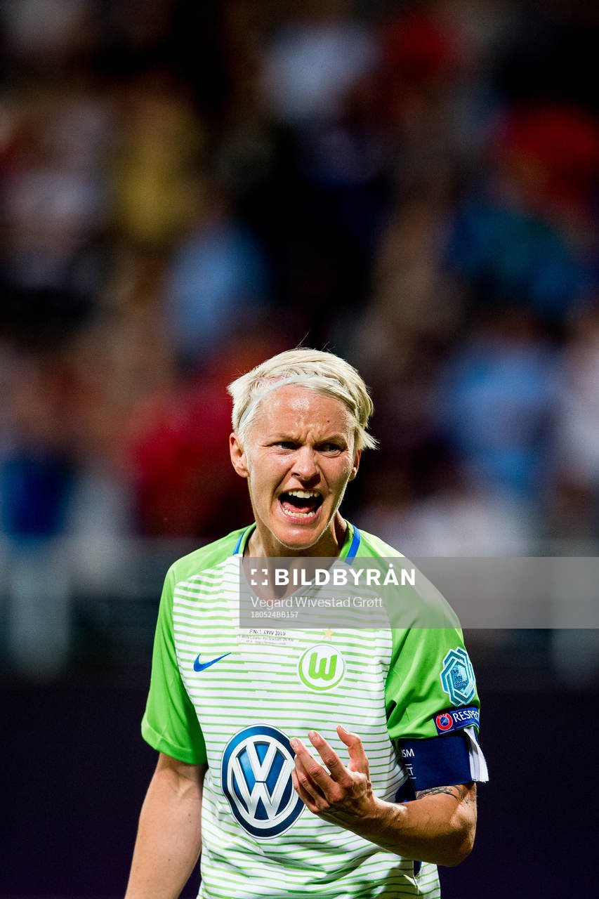 Nilla Fischer of Wolfsburg looks dejected