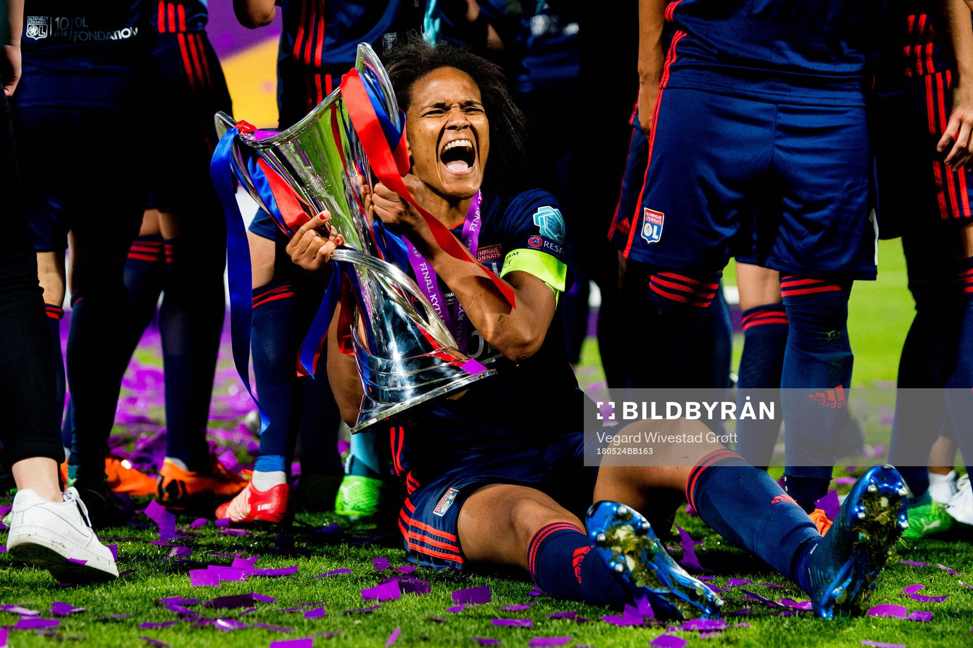 Wendie Renard of Lyon celebrates with the trophy