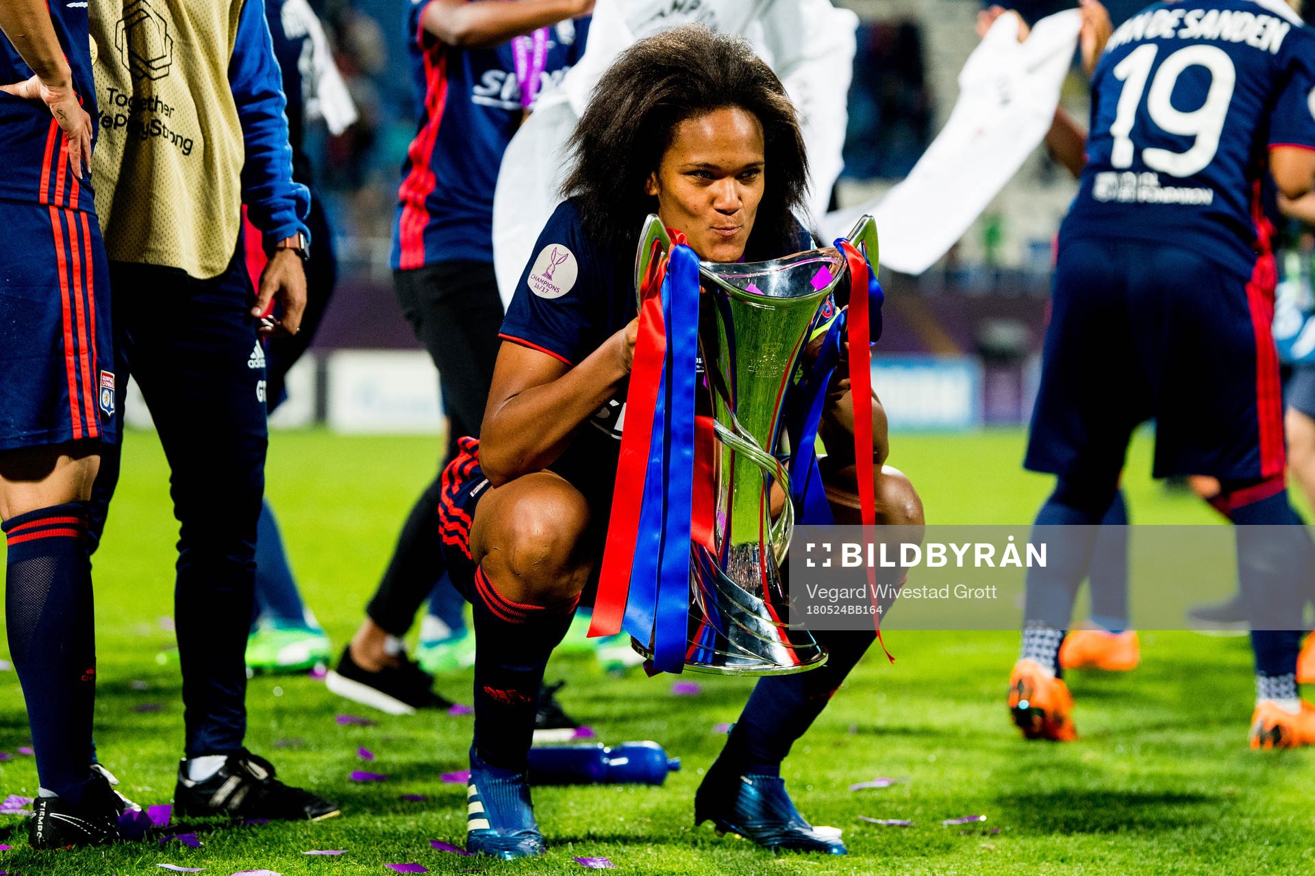 Wendie Renard of Lyon celebrates with the trophy