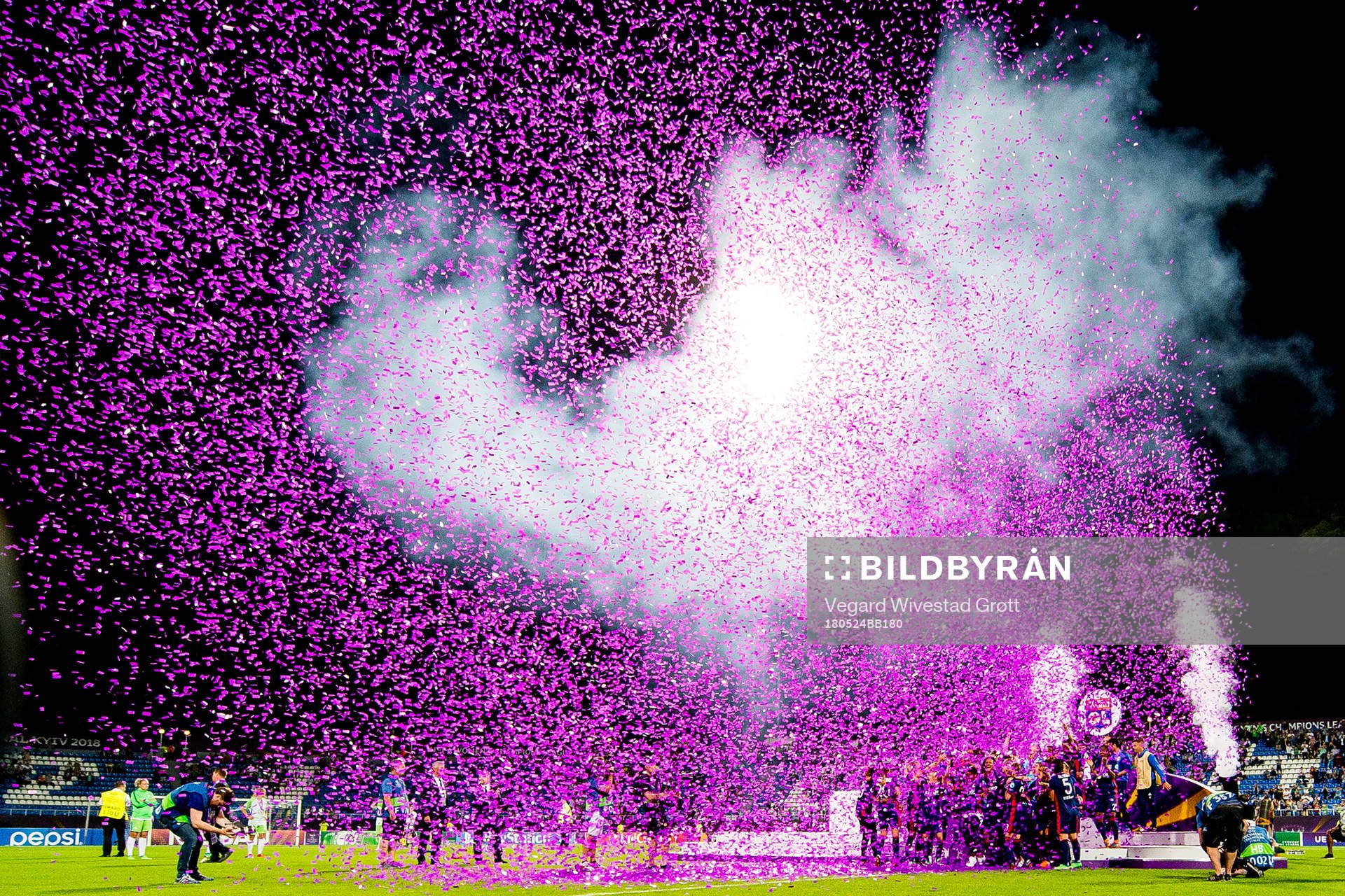 Players and staff of Lyon celebrate