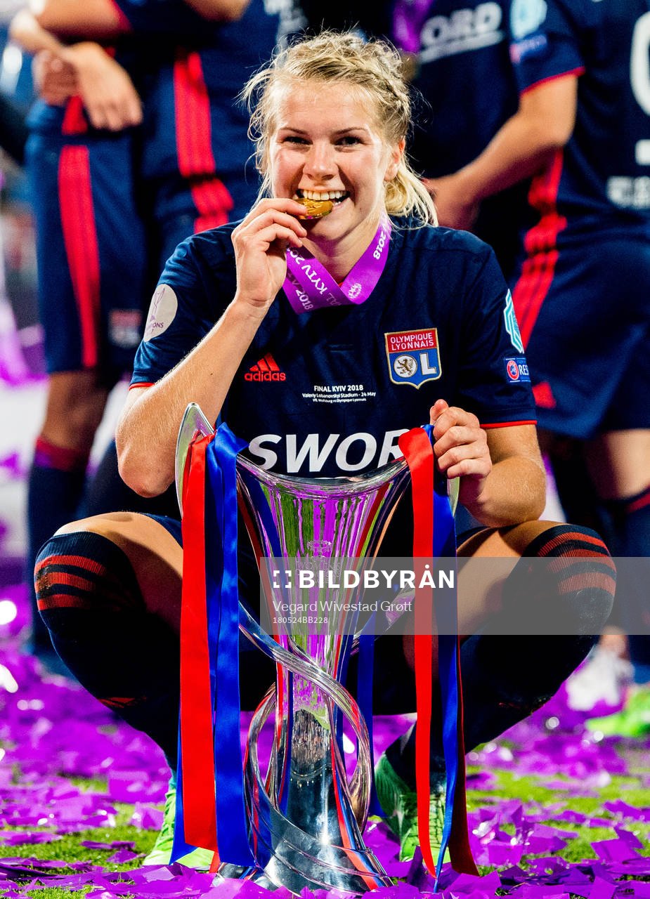 Ada Hegerberg of Lyon celebrates with the trophy
