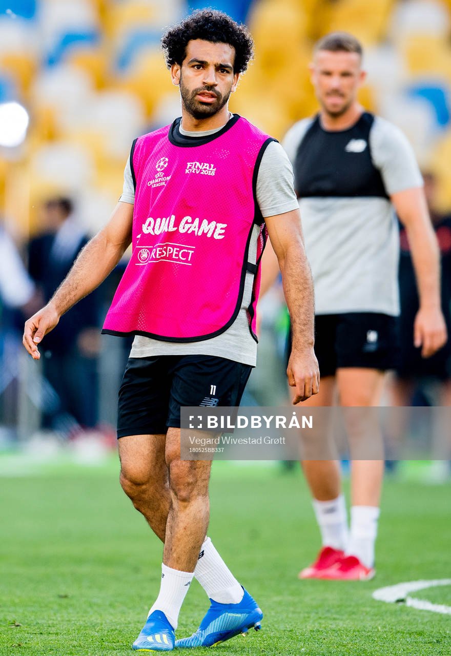 Mohamed Salah and Jordan Henderson of Liverpool