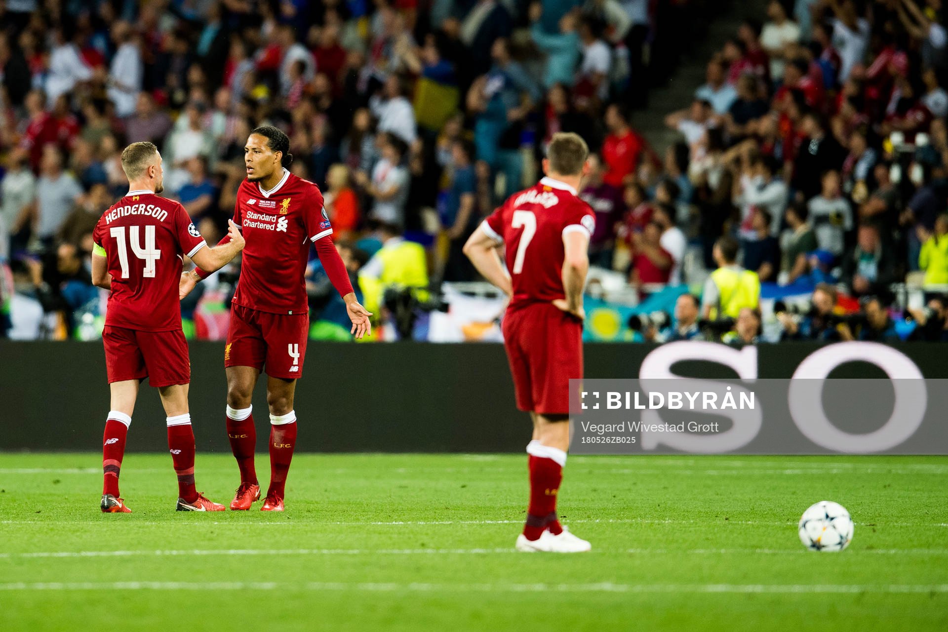Jordan Henderson and Virgil Van Dijk of Liverpool look