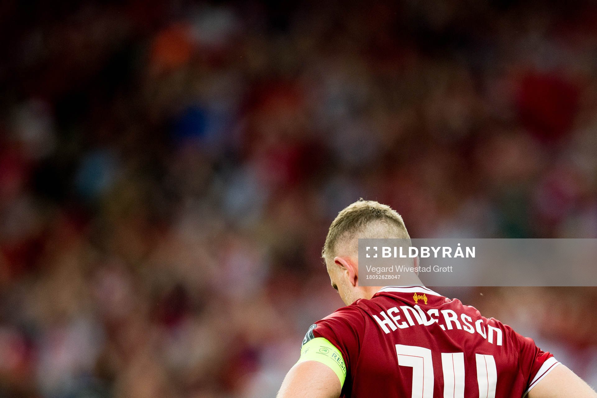 Jordan Henderson of Liverpool looks dejected