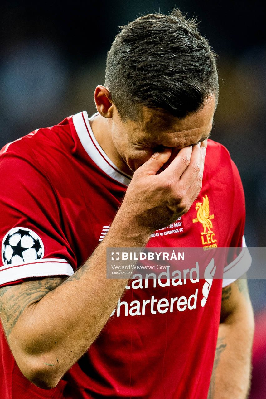 Dejan Lovren of Liverpool looks dejected