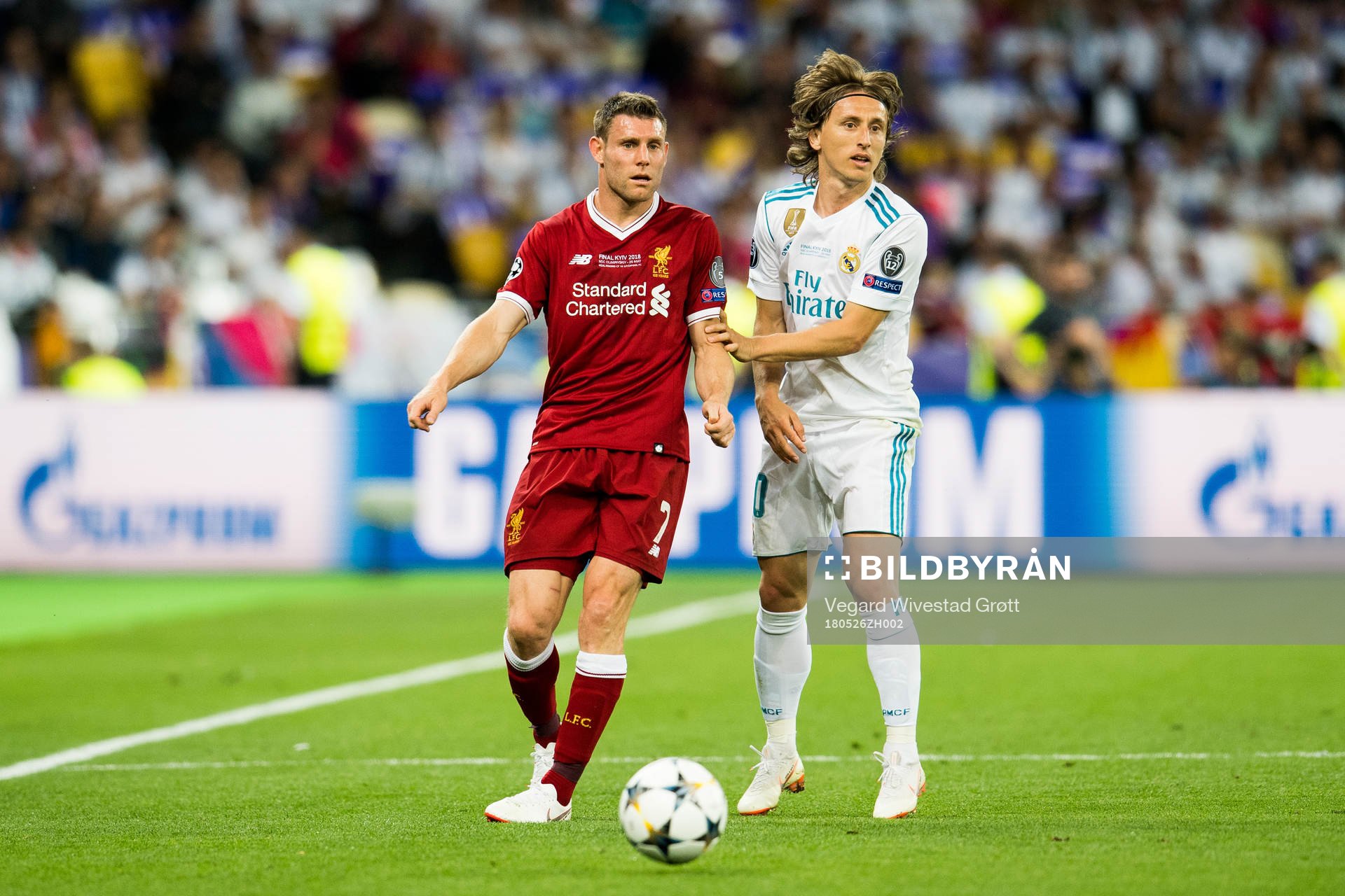 James Milner of Liverpool and Luka Modric of Real Madrid