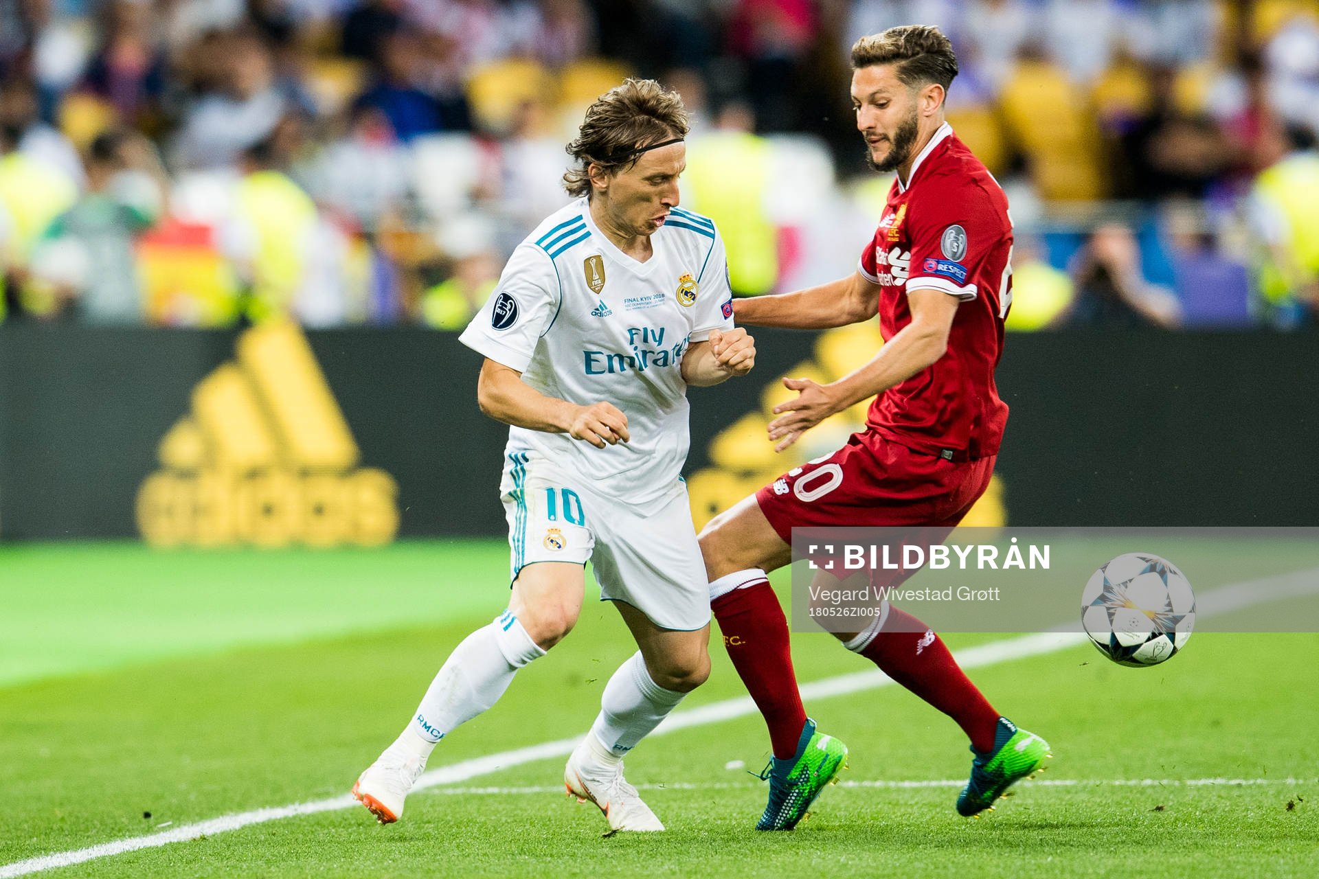 Luka Modric of Real Madrid and Adam Lallana of Liverpool