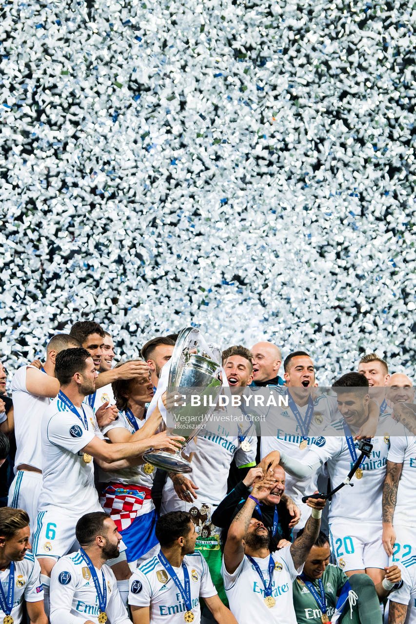 Players of Real Madrid celebrate with the trophy