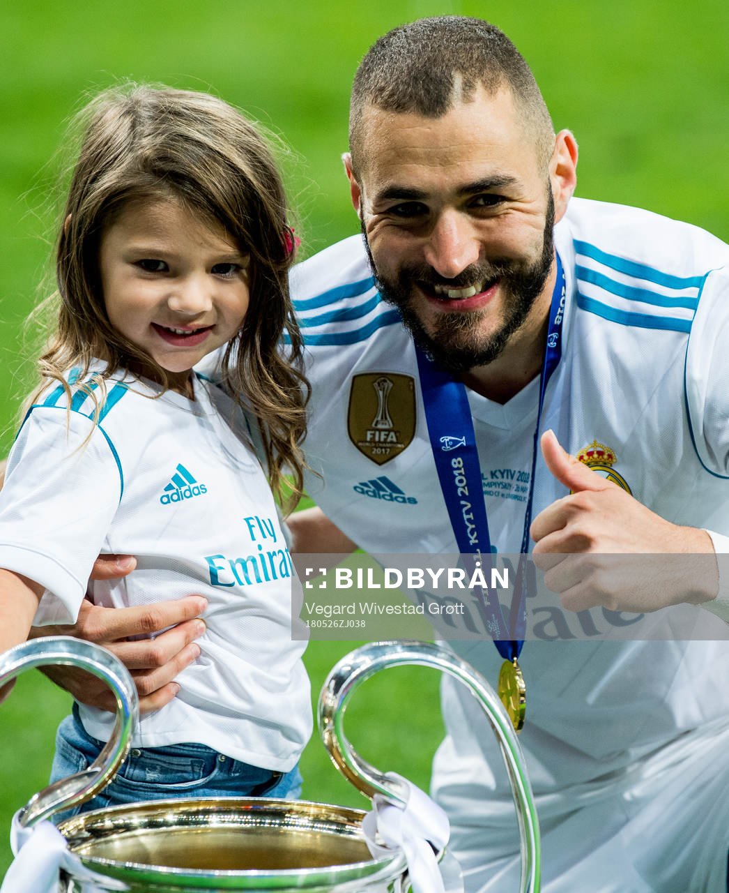 Karim Benzema of Real Madrid celebrates with the trophy