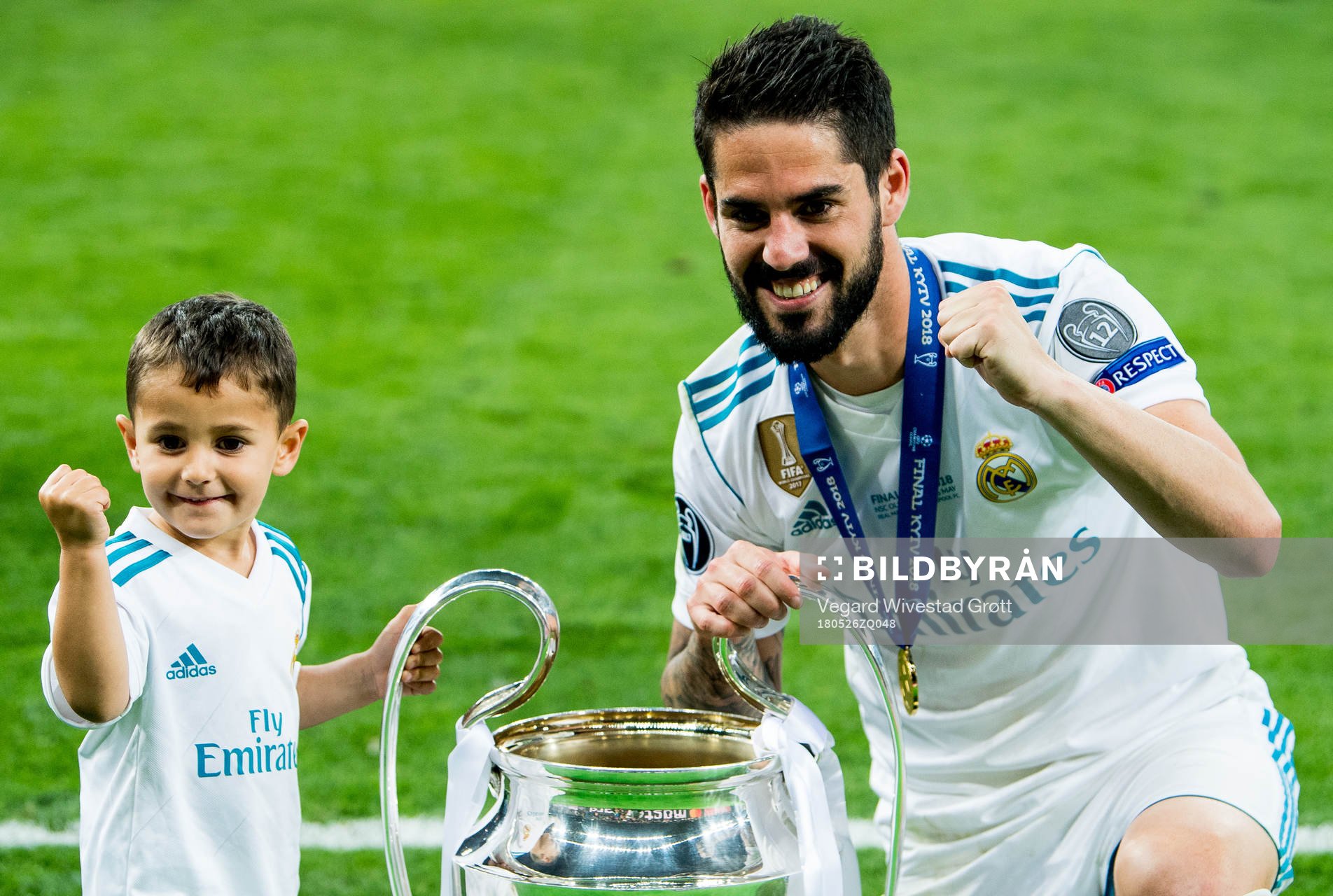 Isco of Real Madrid celebrates with the trophy after winning the UEFA Champions League final between Real Madrid and Liverpool on May 26, 2018 in Kyiv.