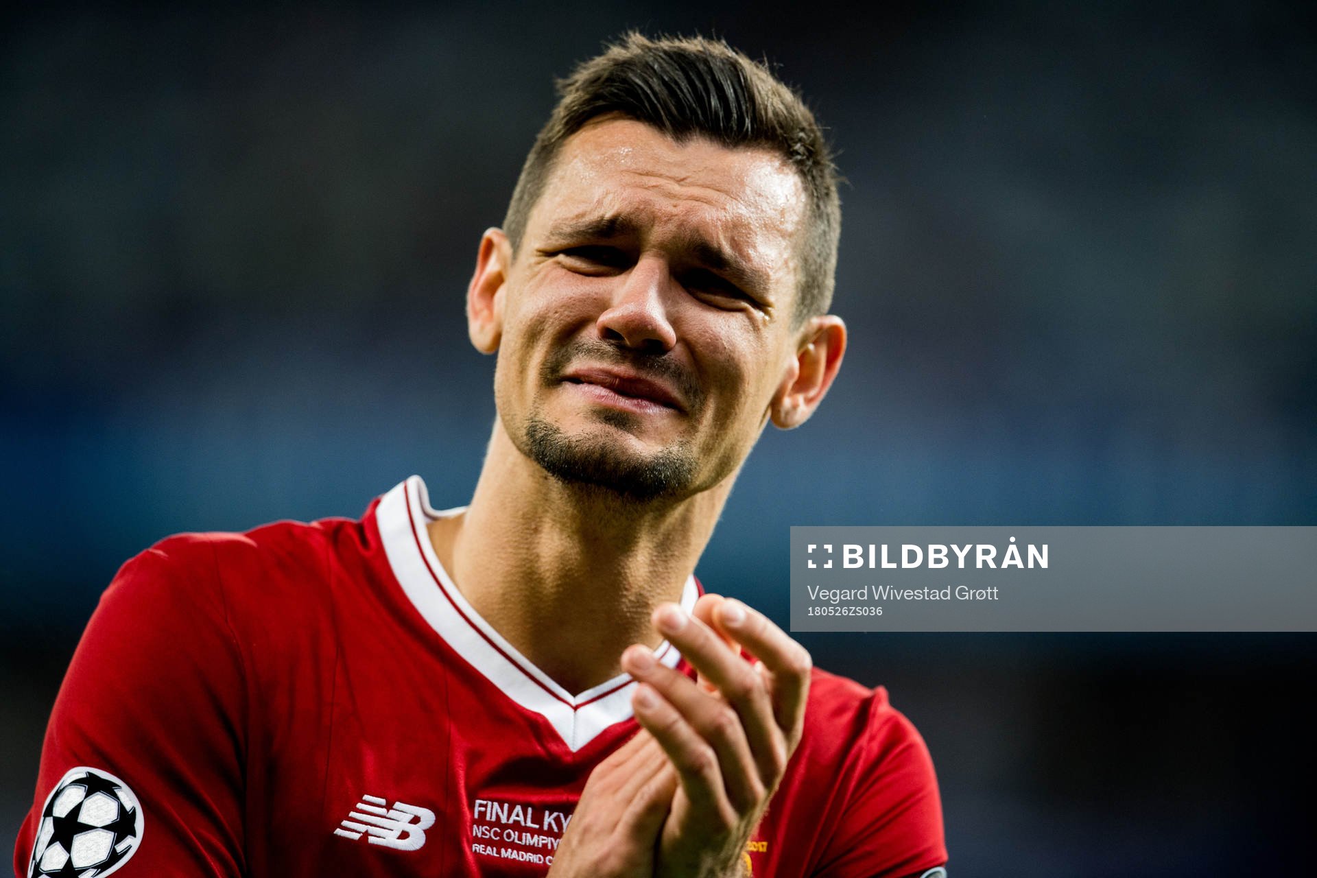 Dejan Lovren of Liverpool looks dejected