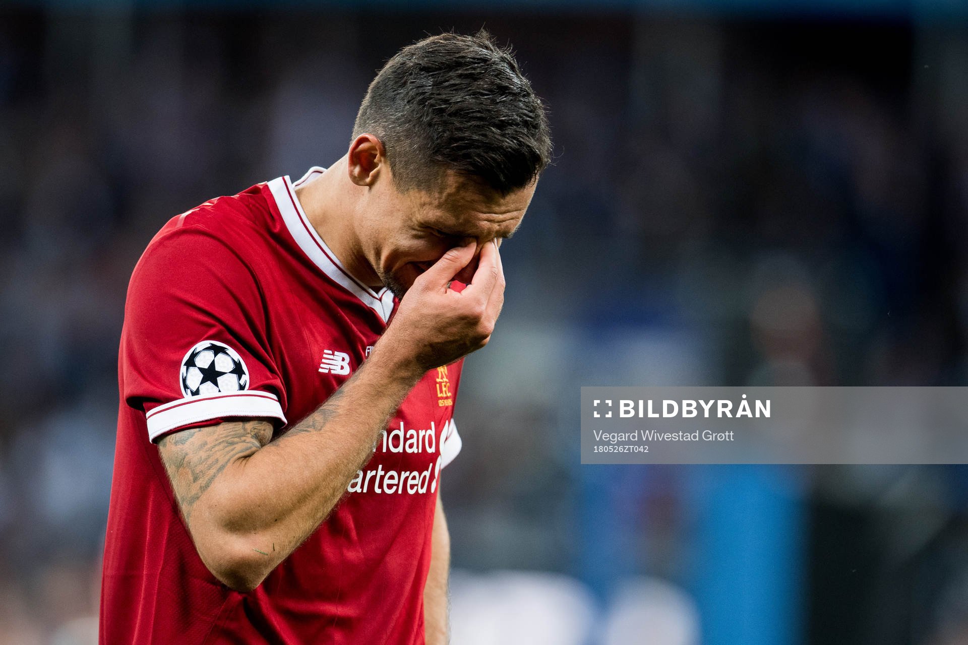 Dejan Lovren of Liverpool looks dejected