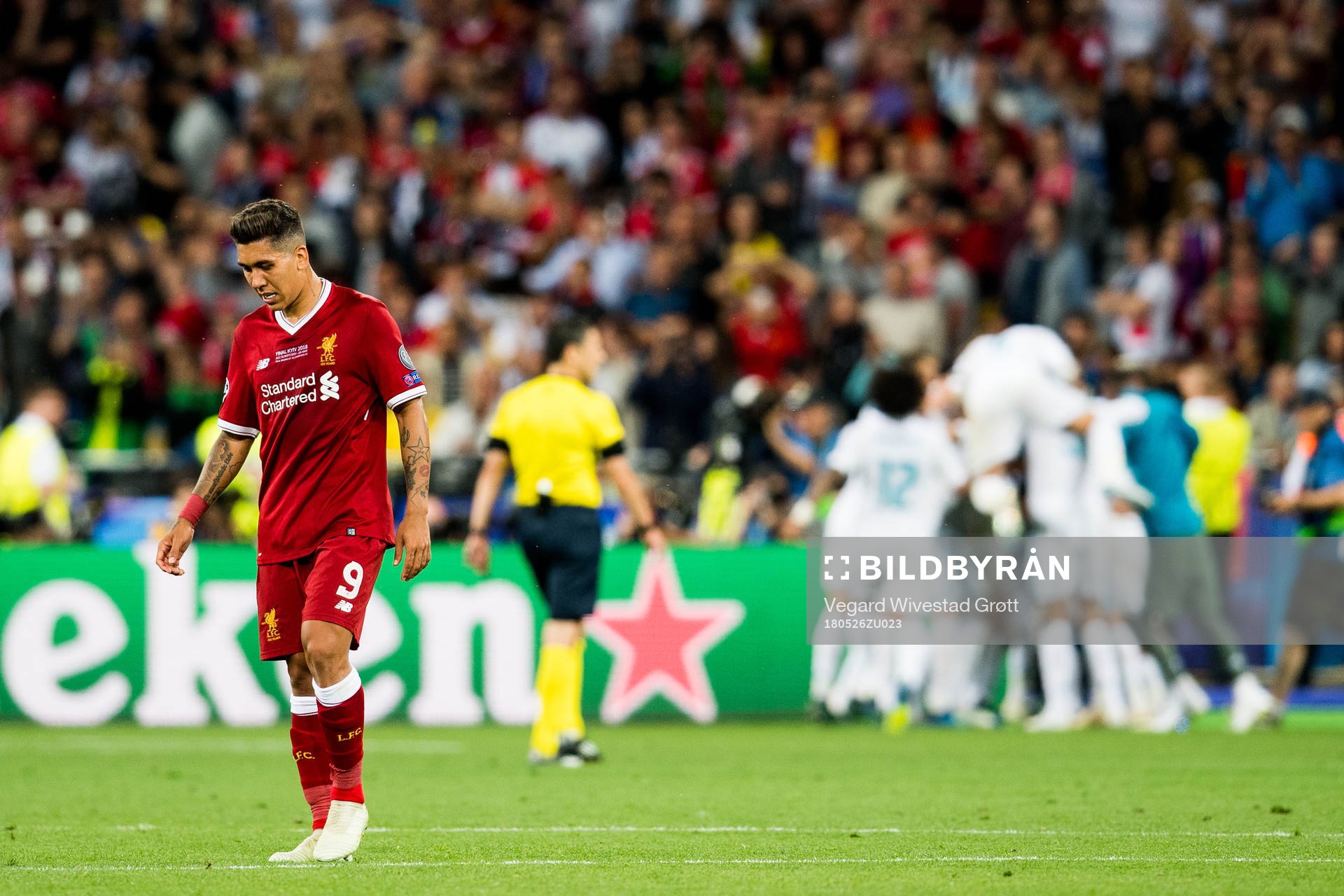 Roberto Firmino of Liverpool looks dejected