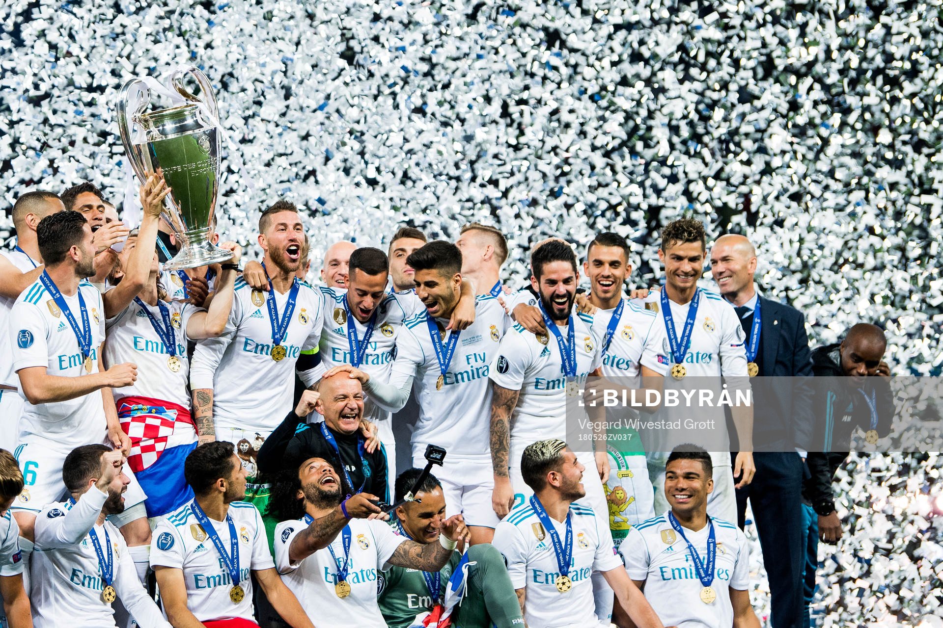 Players of Real Madrid celebrate with the trophy