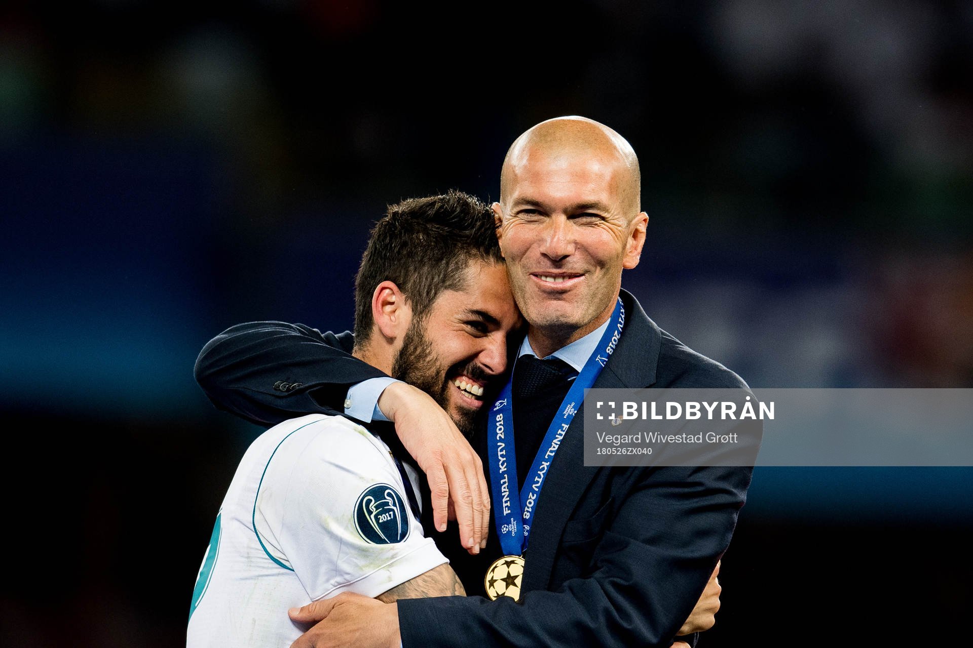 Isco of Real Madrid and Zinedine Zidane, head coach of Real Madrid, celebrate after the UEFA Champions League final between Real Madrid and Liverpool on May 26, 2018 in Kyiv.