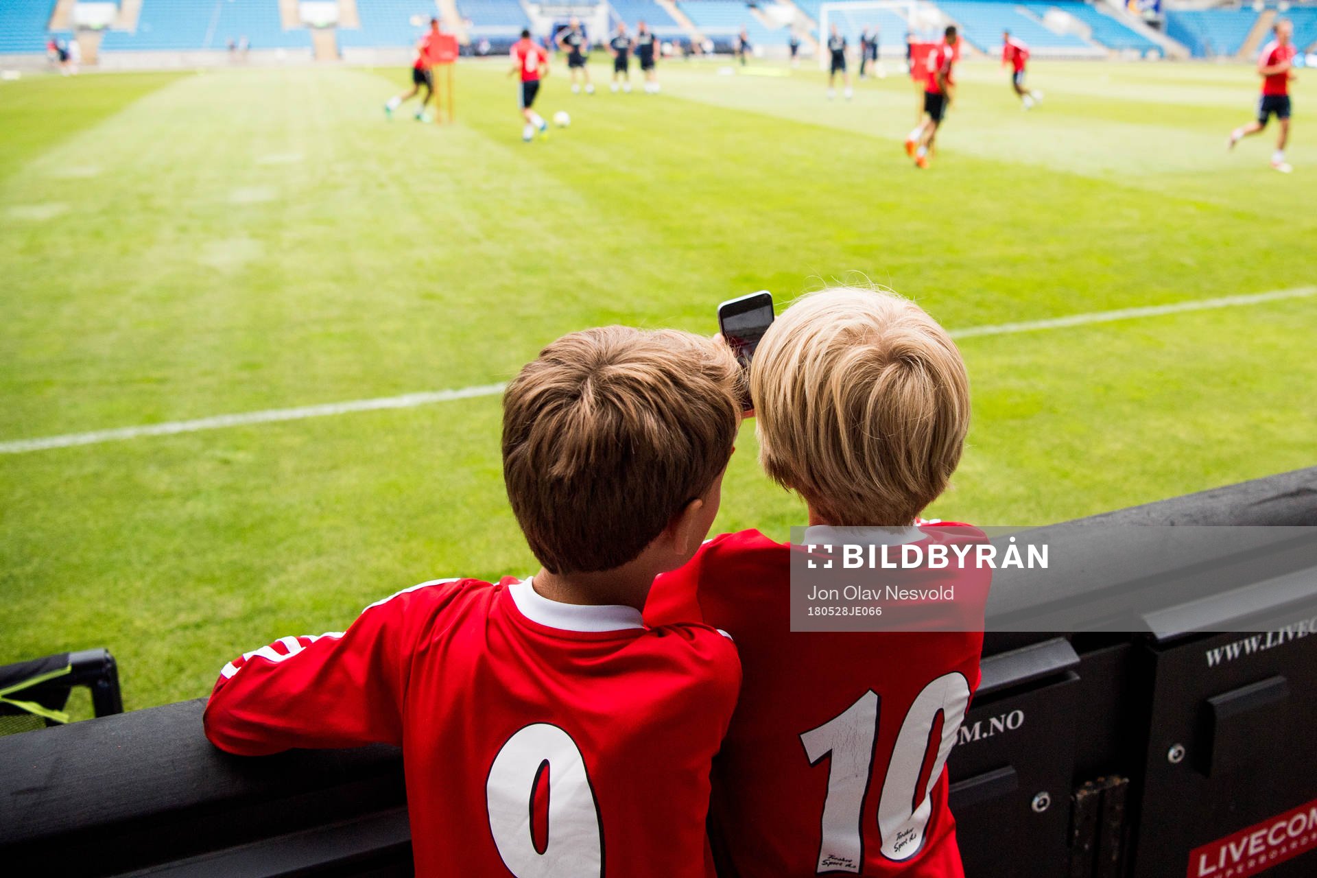 Children watch the players of Norway