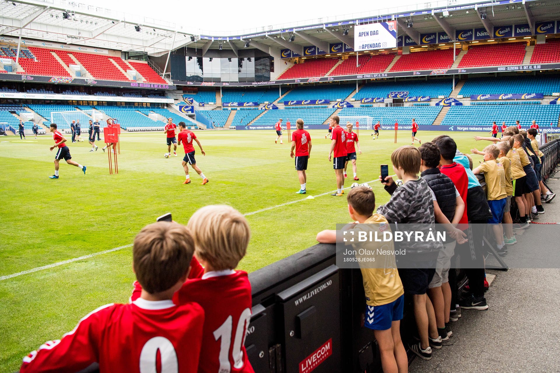Children watch the players of Norway