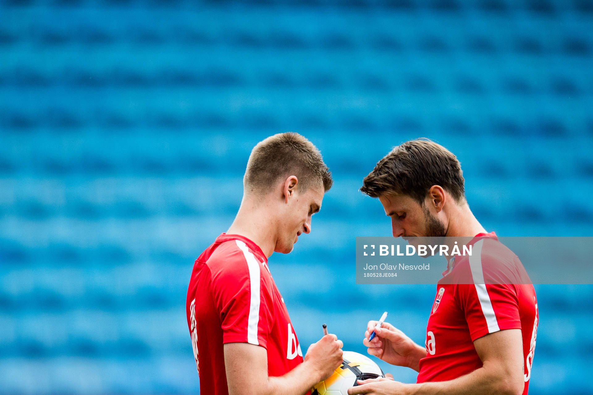Markus Henriksen and Håvard Nordtveit of Norway sign a ball