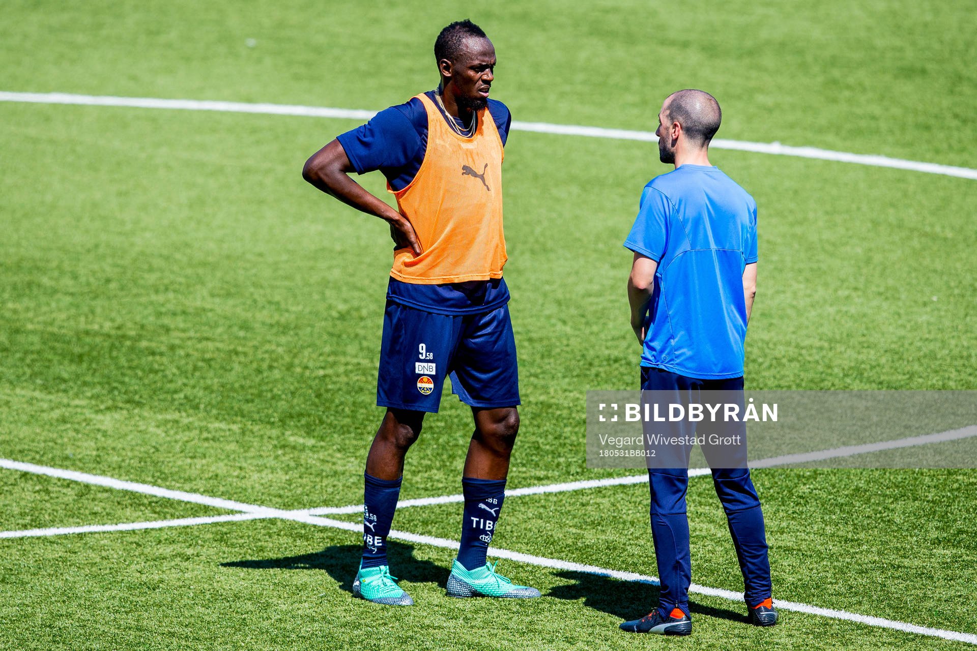 Usain Bolt and Martin Foyston, assistant coach of