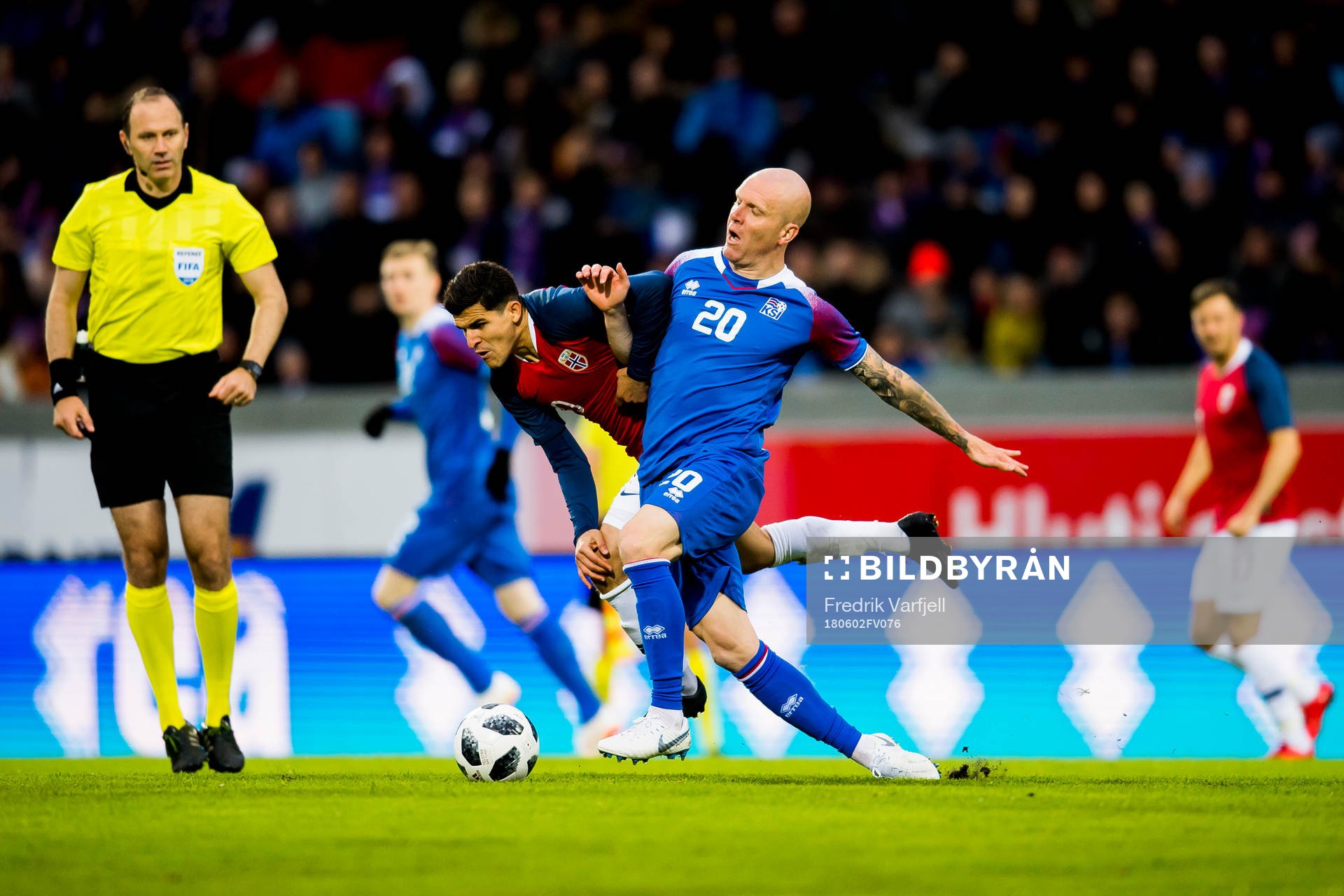 Tarik Elyounoussi of Norway and Emil Hallfreðsson of