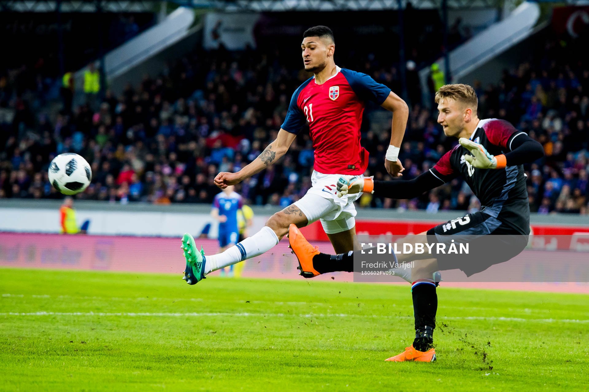 Bjørn Maars Johnsen of Norway and goalkeeper Frederik Schram of Iceland during the international friendly football match between Iceland and Norway on June 2, 2018 in Reykjavik.