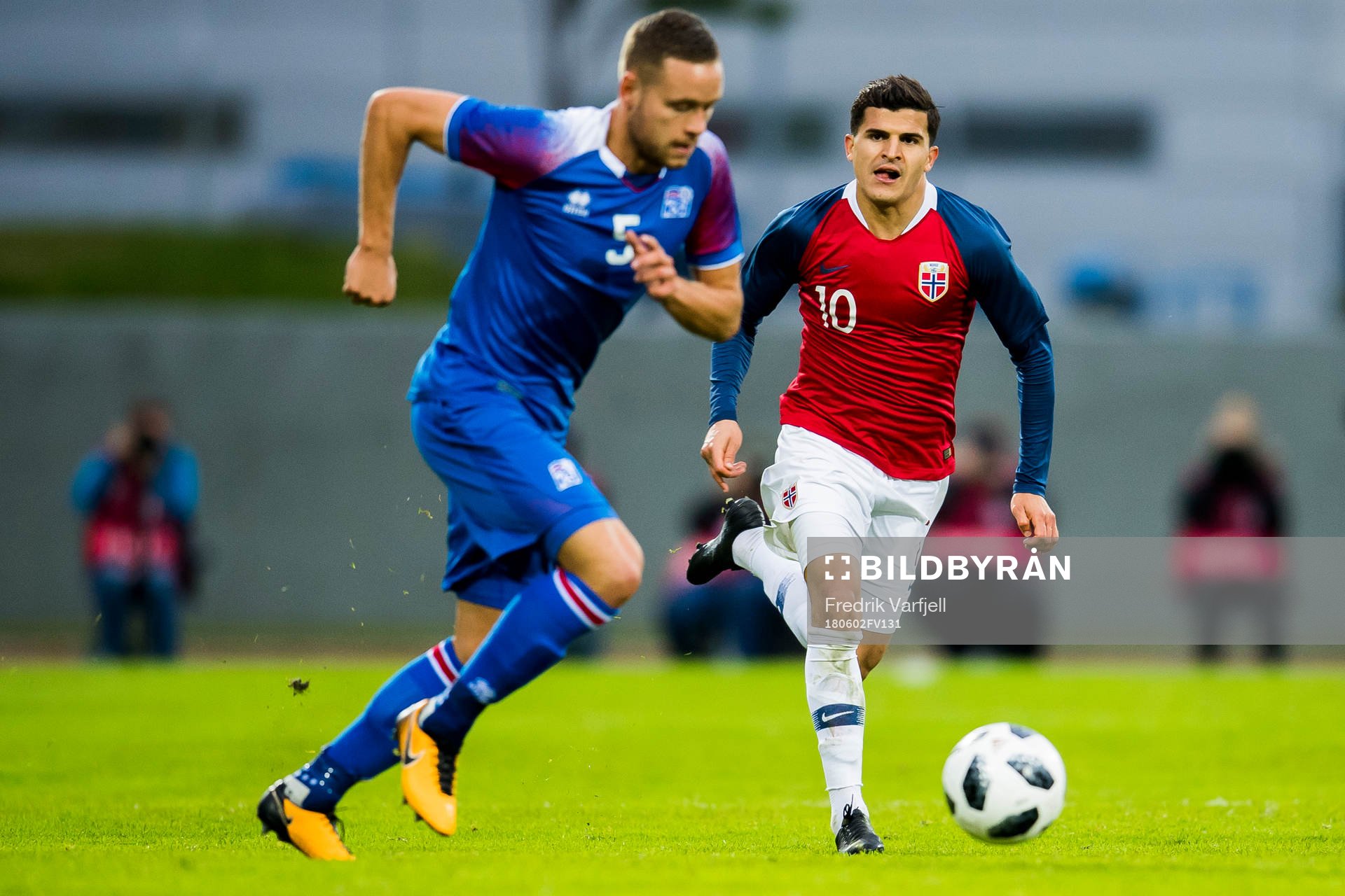 Sverrir Ingason of Iceland and Tarik Elyounoussi of Norway
