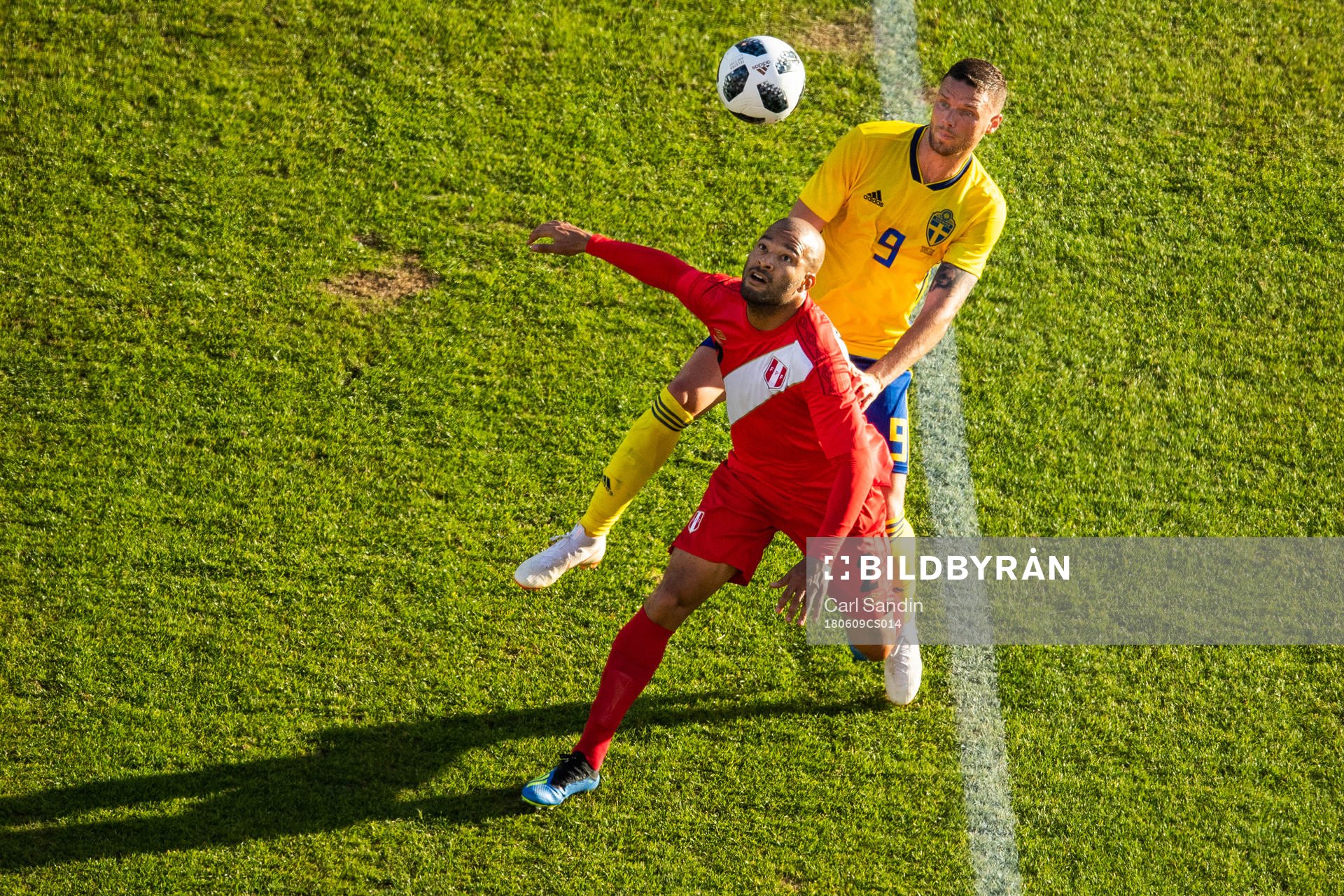 Albert Rodriguez of Peru competes for the ball with Marcus