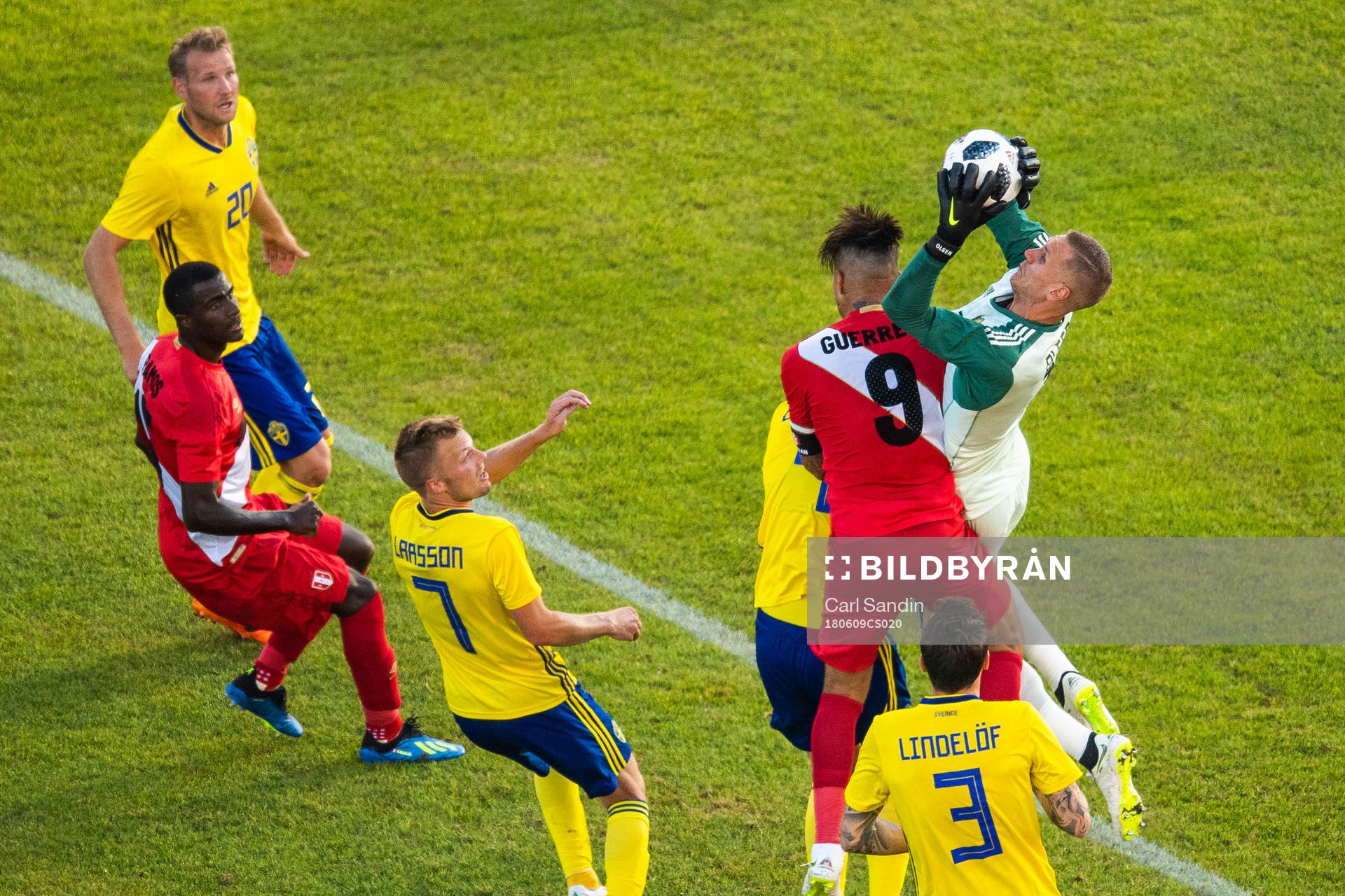 Paolo Guerrero of Peru competes for the ball with