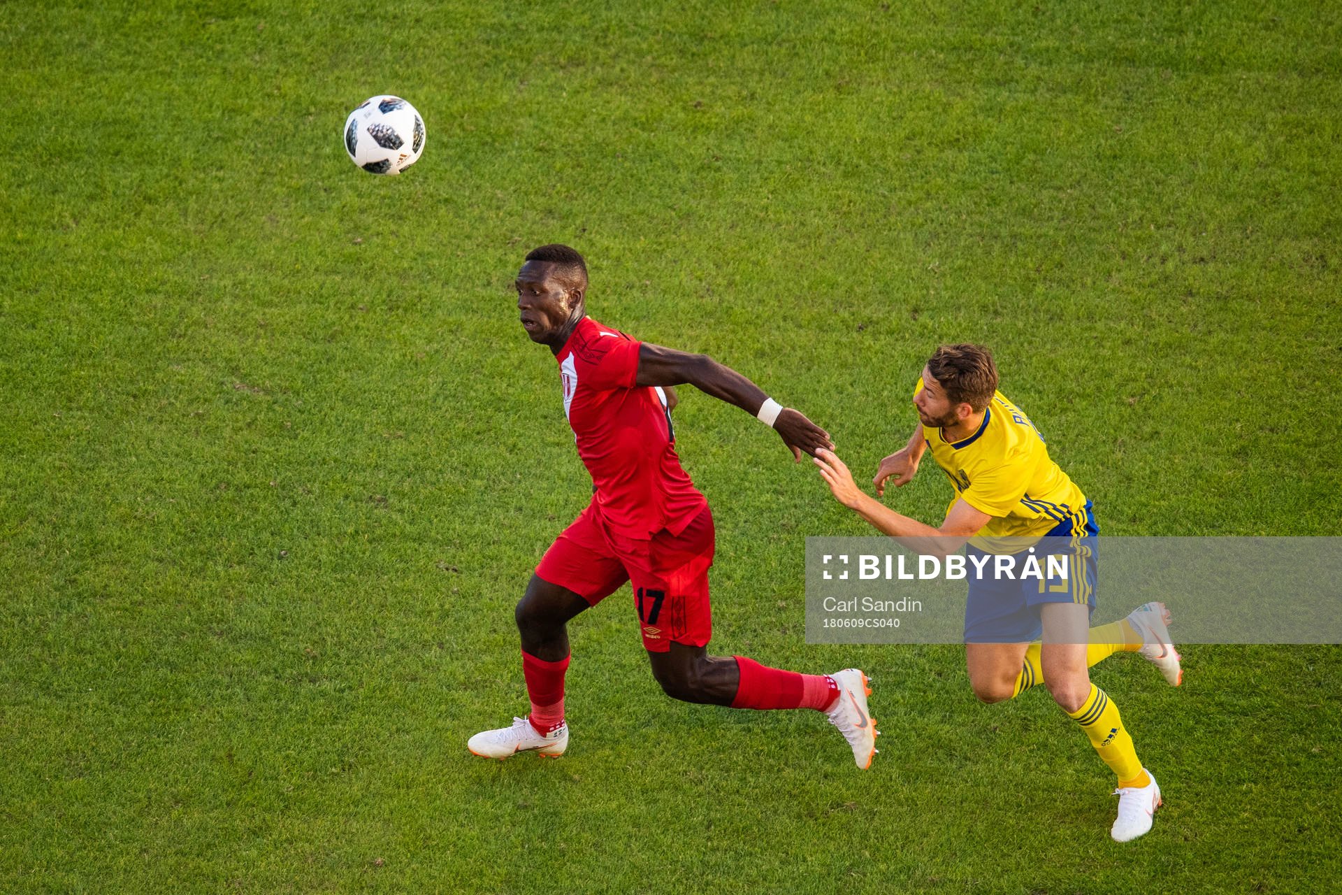 Luis Advincula of Peru competes for the ball with Marcus