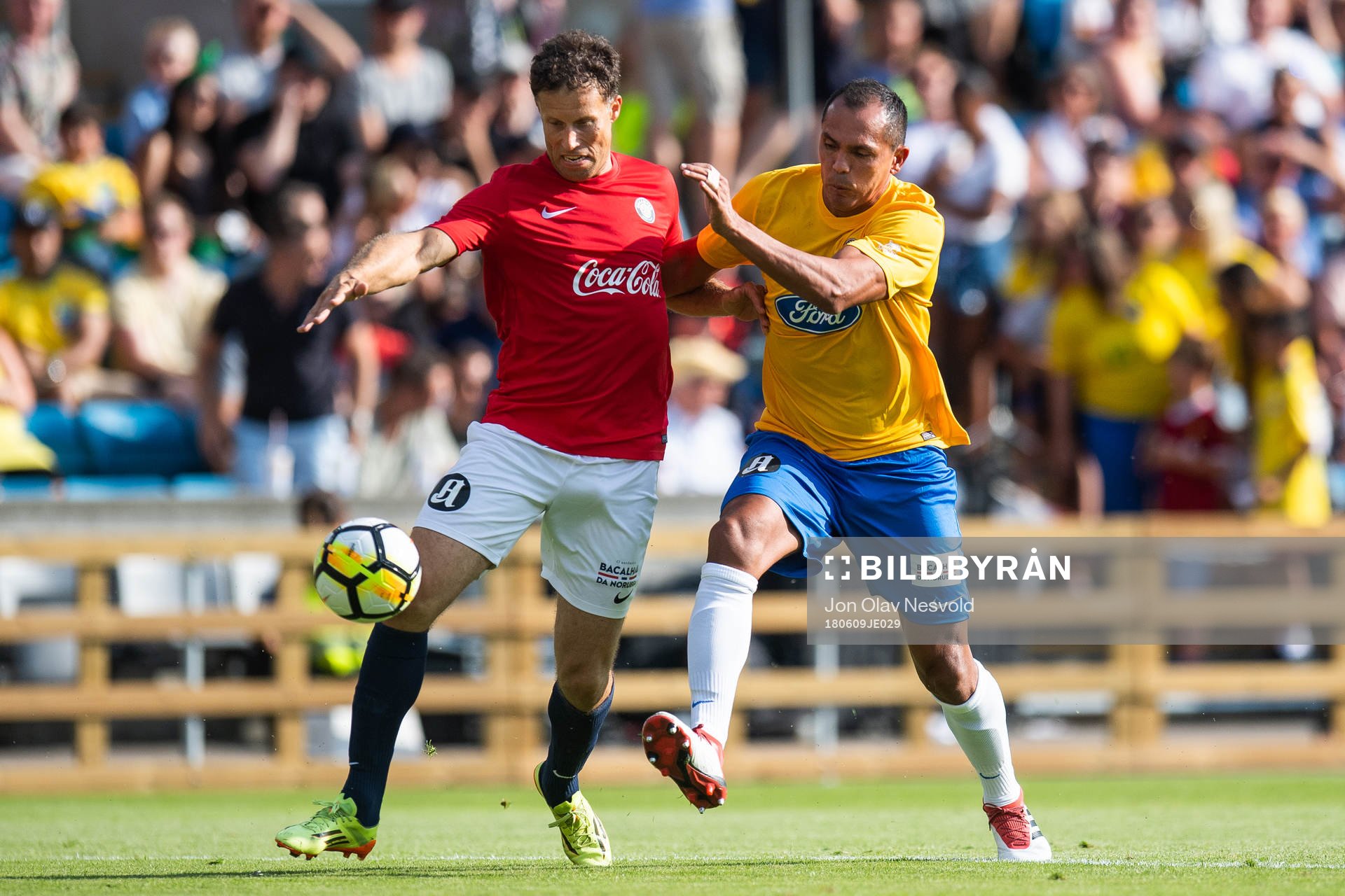 Giovanni of Brazil competes for the ball with Ronny Johnsen