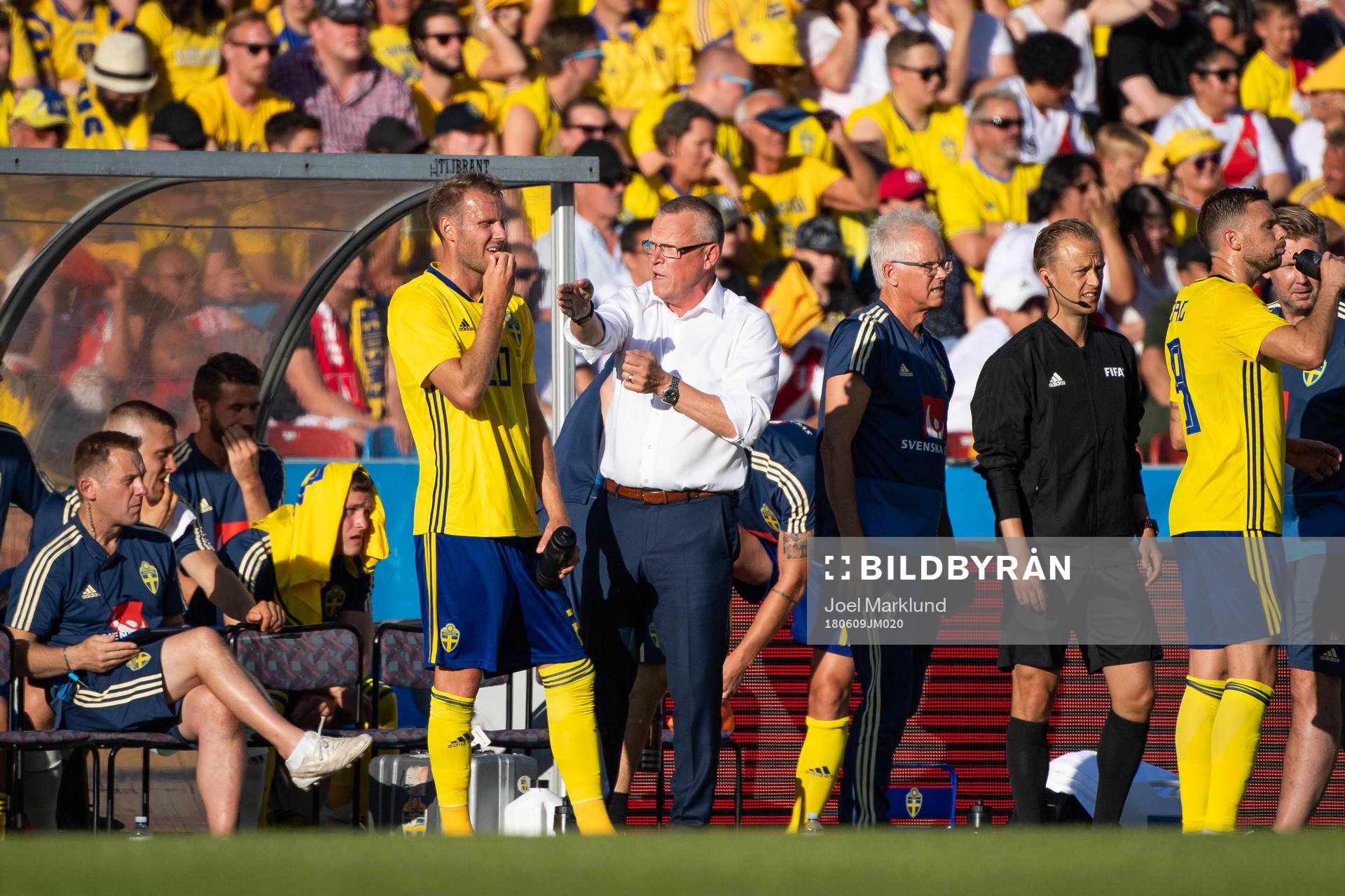 Ola Toivonen of Sweden is given instructions by Janne