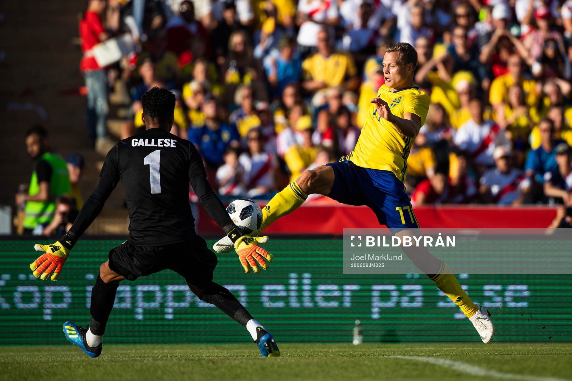 Viktor Claesson of Sweden challenges goalkeeper Pedro