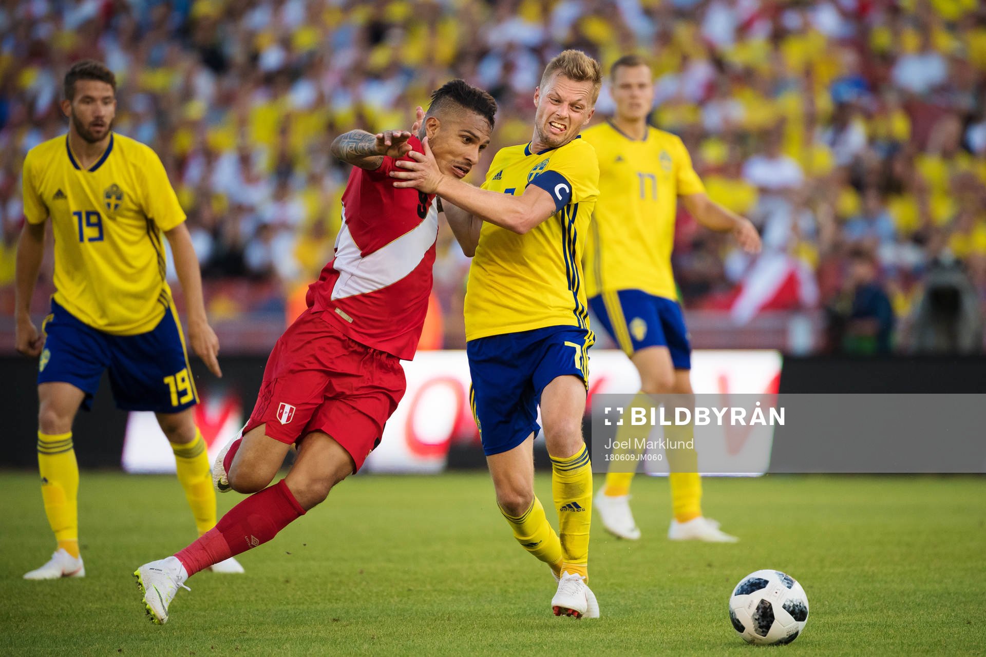 Paolo Guerrero of Peru is being stopped by Sebastian