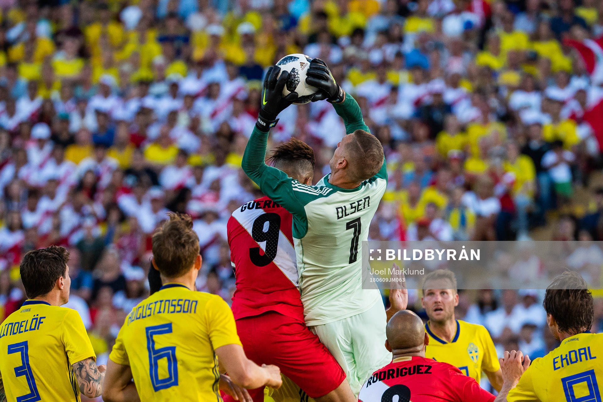 Paolo Guerrero of Peru collides with goalkeeper Robin Olsen