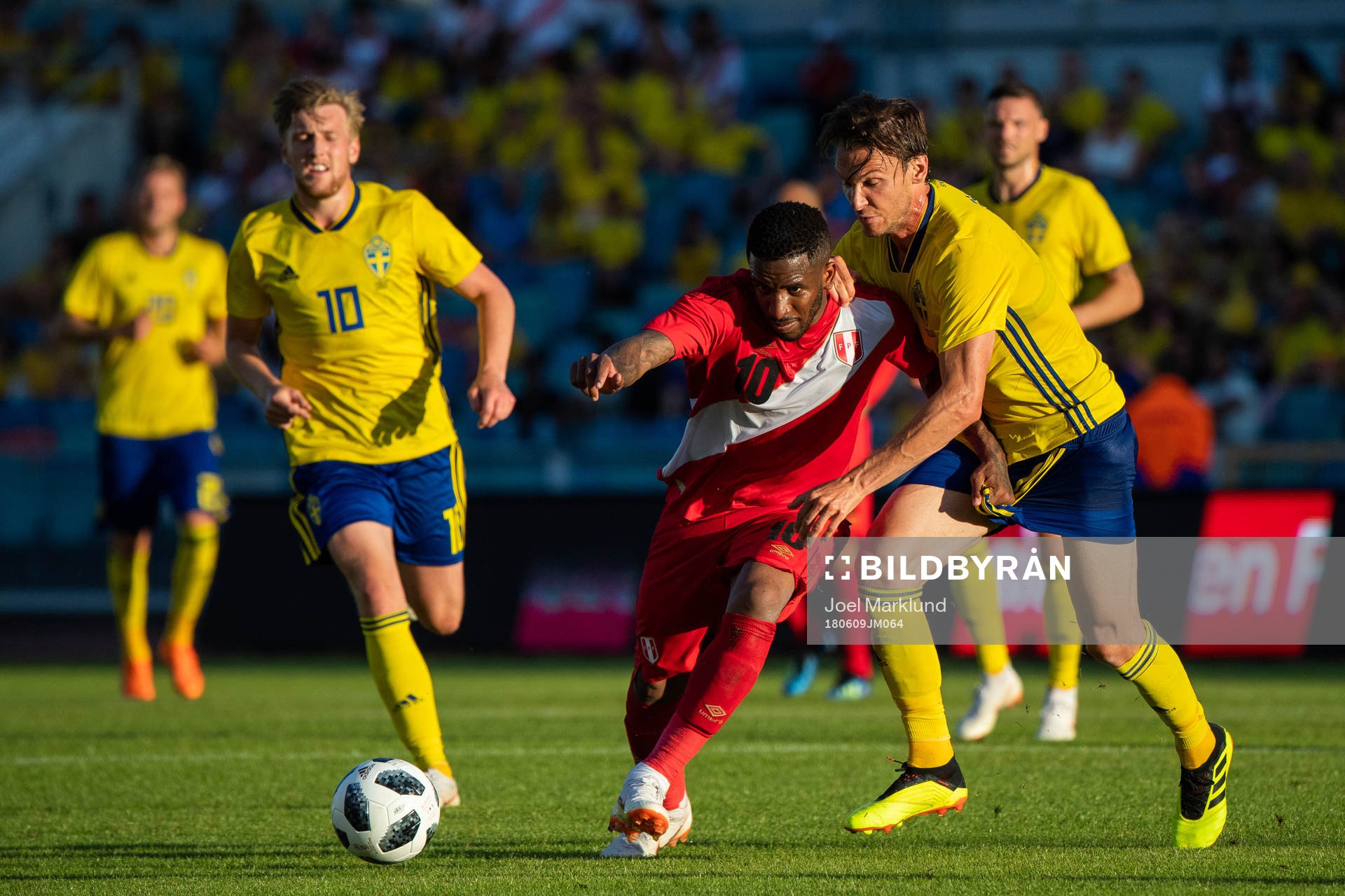 Jefferson Farfan of Peru competes for the ball with Albin