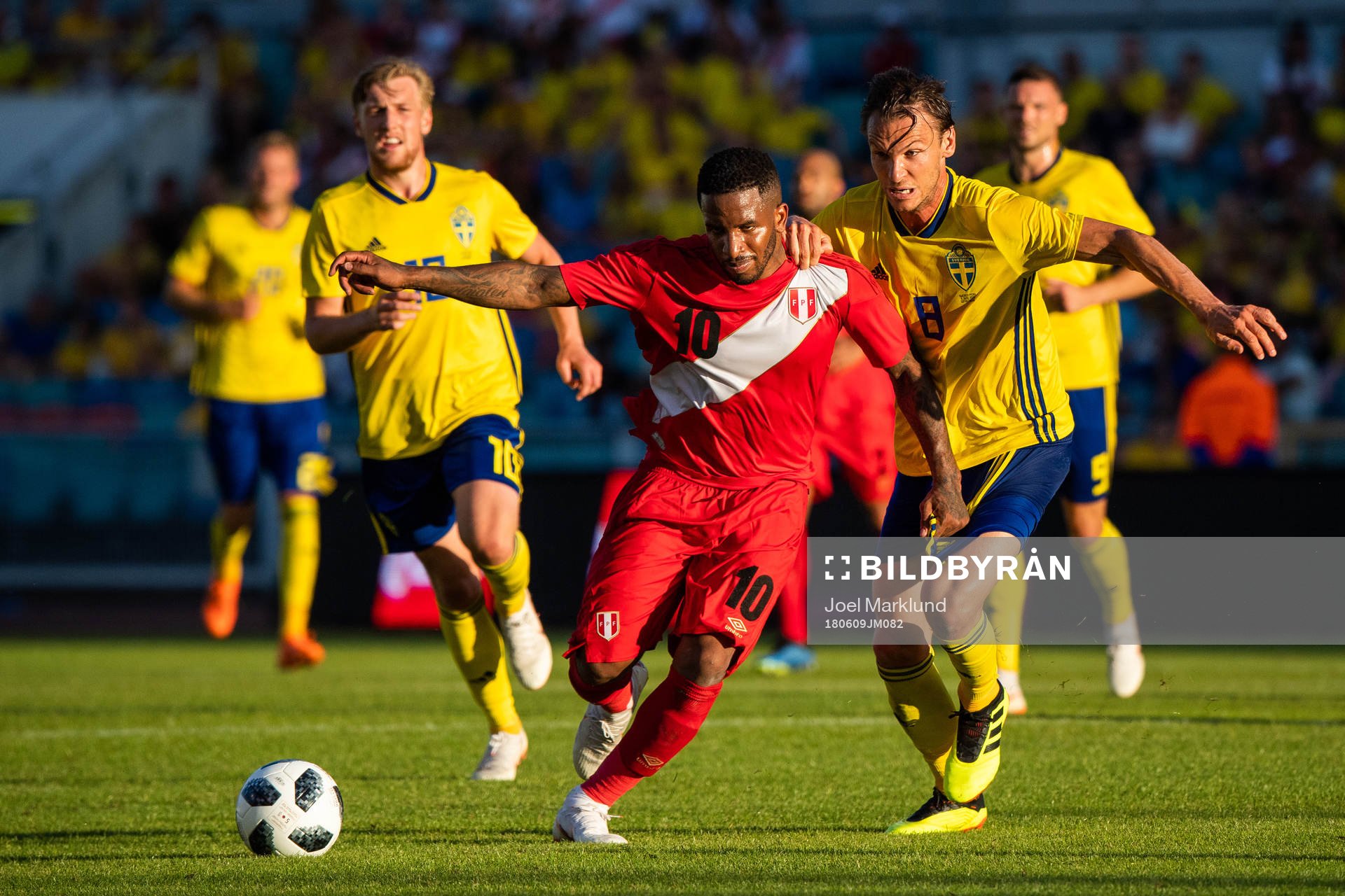 Jefferson Farfan of Peru competes for the ball with Albin