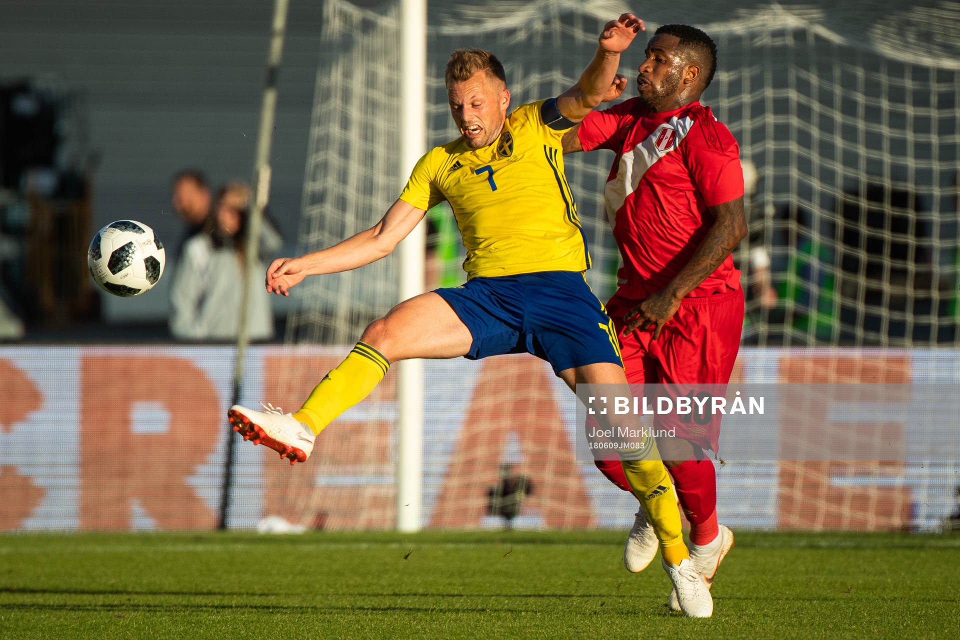 Sebastian Larsson of Sweden competes for the ball with