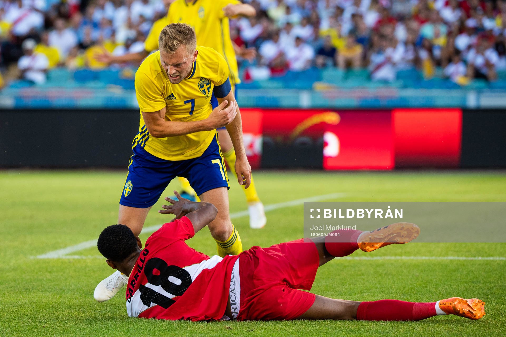 Sebastian Larsson of Sweden reacts at André Carrillo of