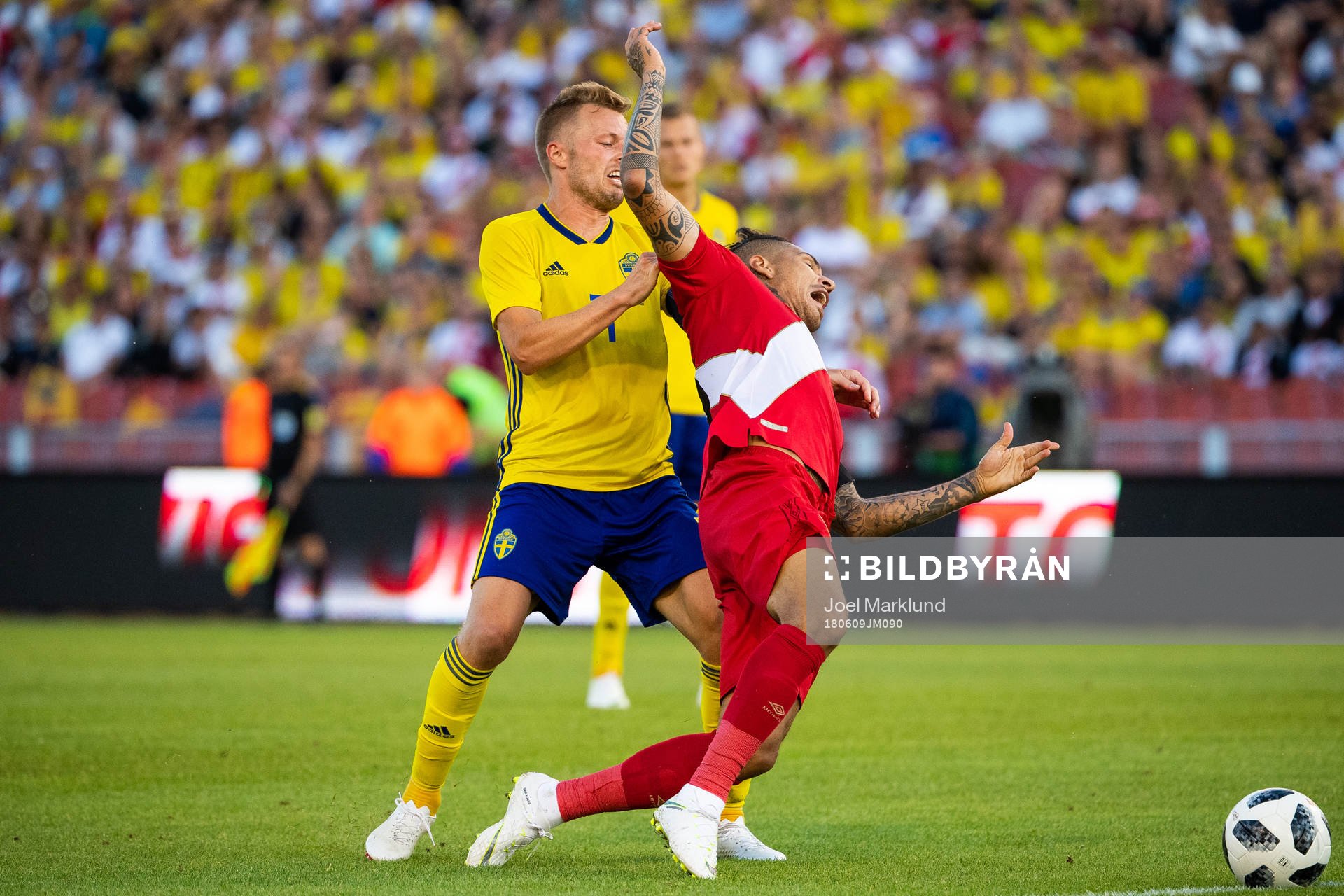 Paolo Guerrero of Peru falls when competing for the ball